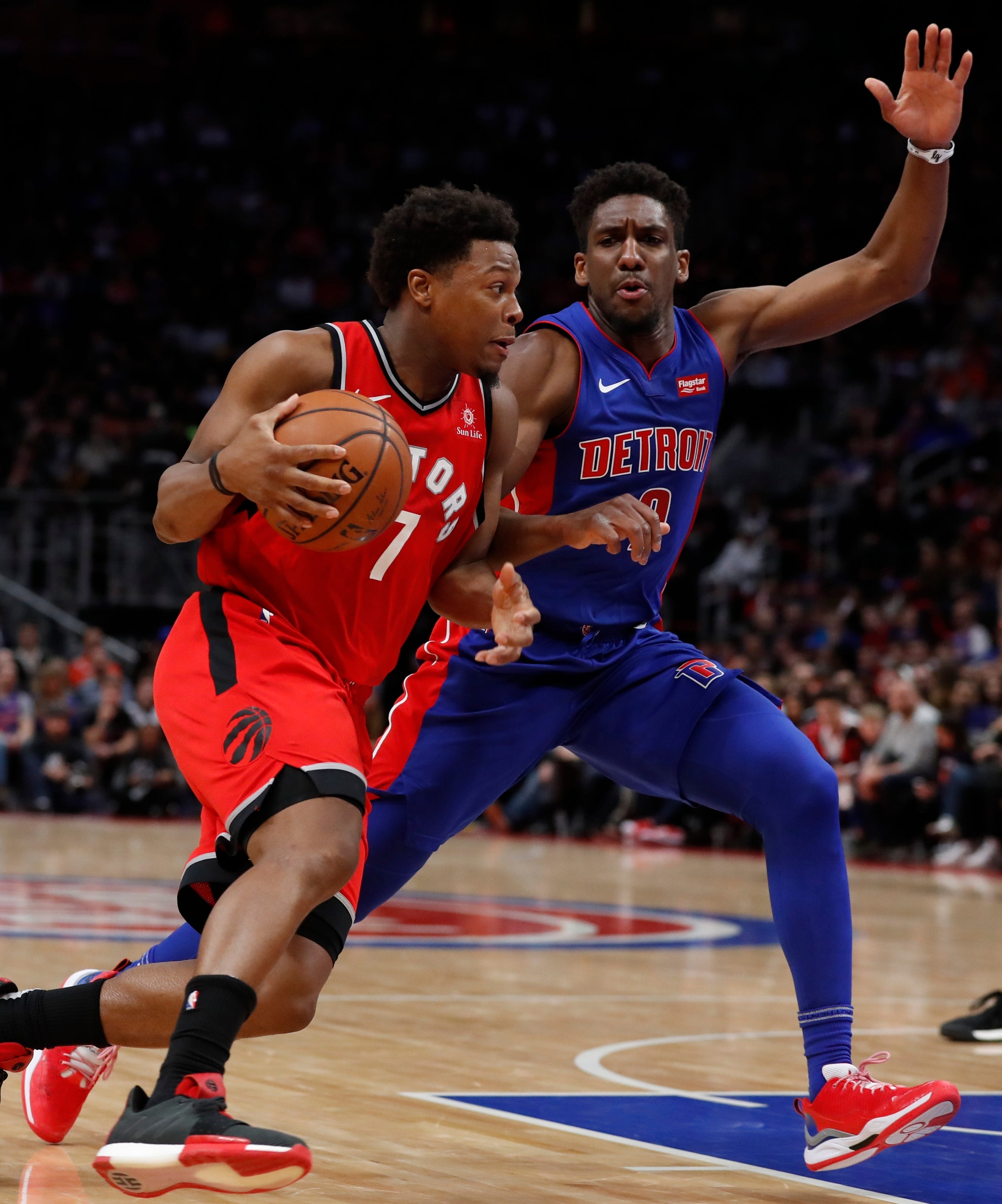 Toronto Raptors guard Kyle Lowry (7) drives on Detroit Pistons guard Langston Galloway (9) during the second half.