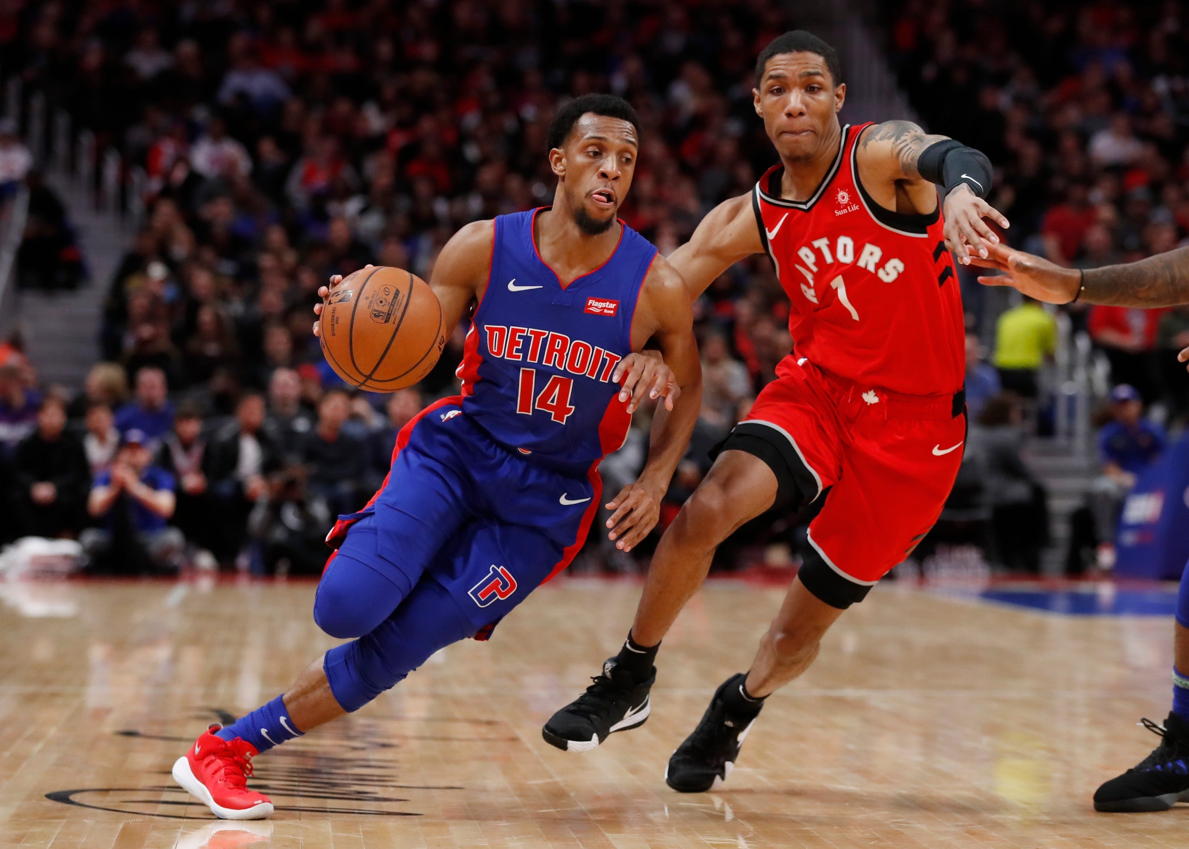 Detroit Pistons guard Ish Smith (14) drives against Toronto Raptors guard Patrick McCaw (1) during the first half.