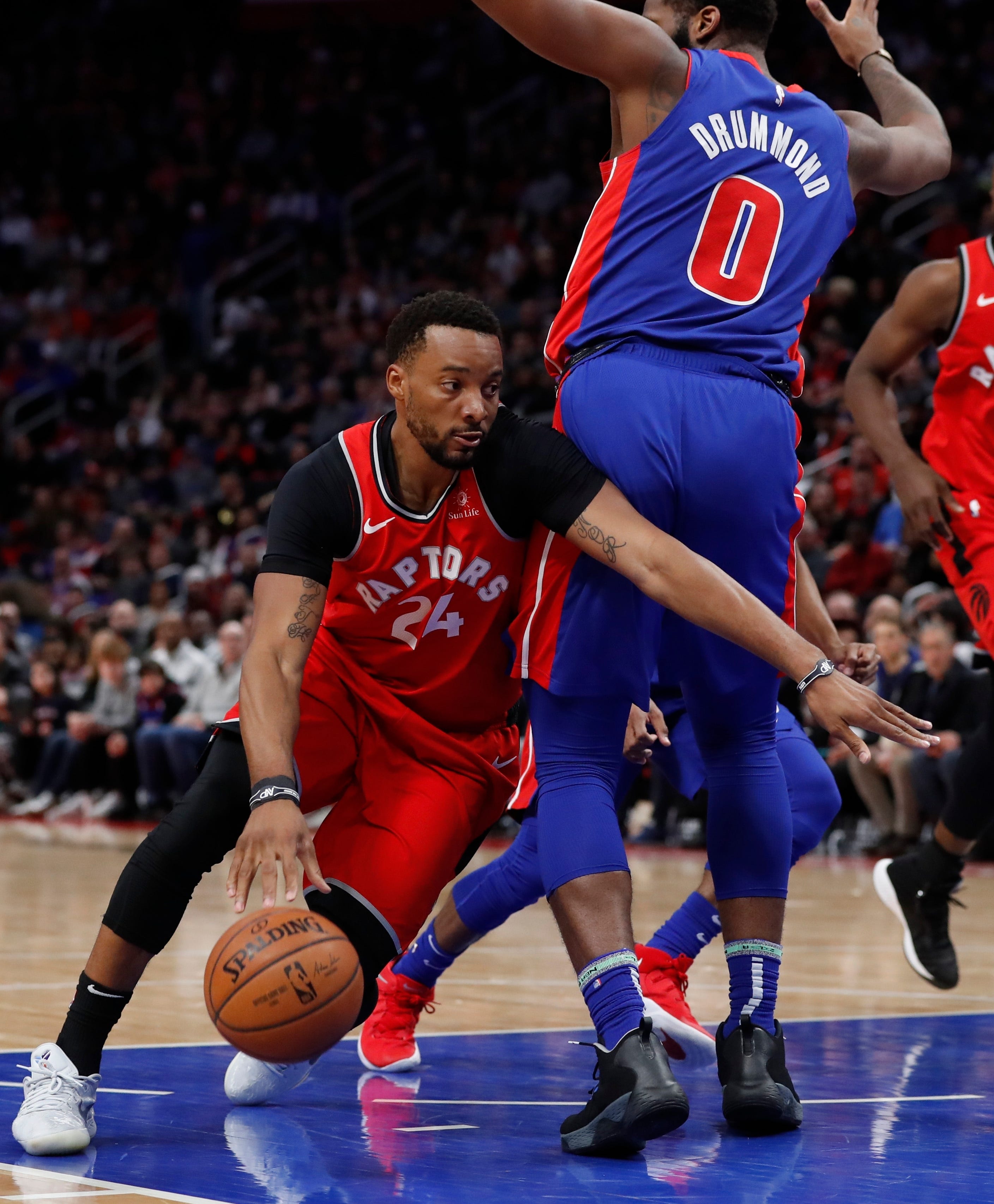 Toronto Raptors forward Norman Powell drives around Detroit Pistons center Andre Drummond (0) during the second half.