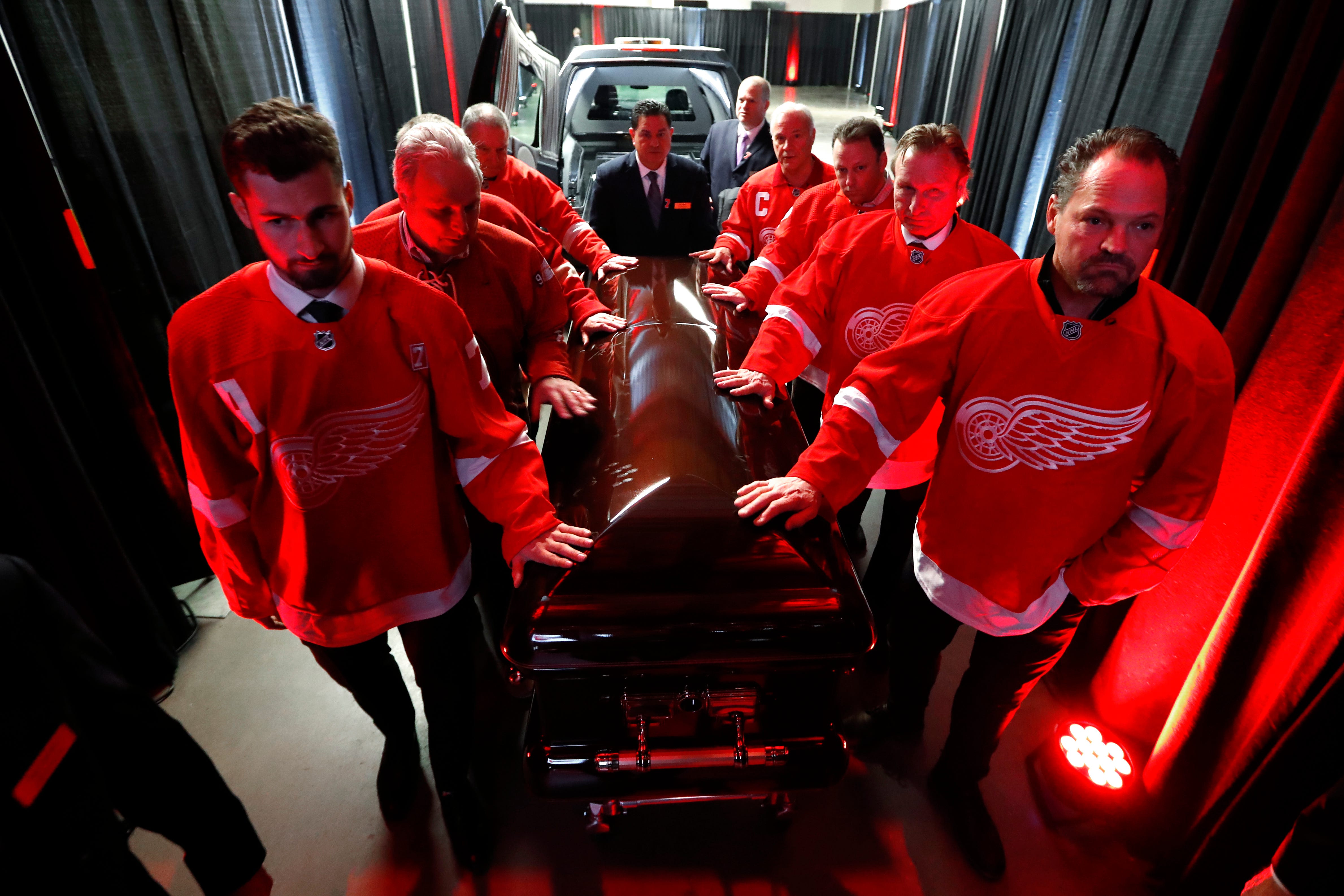 Pallbearers including Dylan Larkin, left, and Joe Kocur move the casket of former Detroit Red Wings player Ted Lindsay for the public viewing Friday, March 8, 2019, at Little Caesars Arena in Detroit.