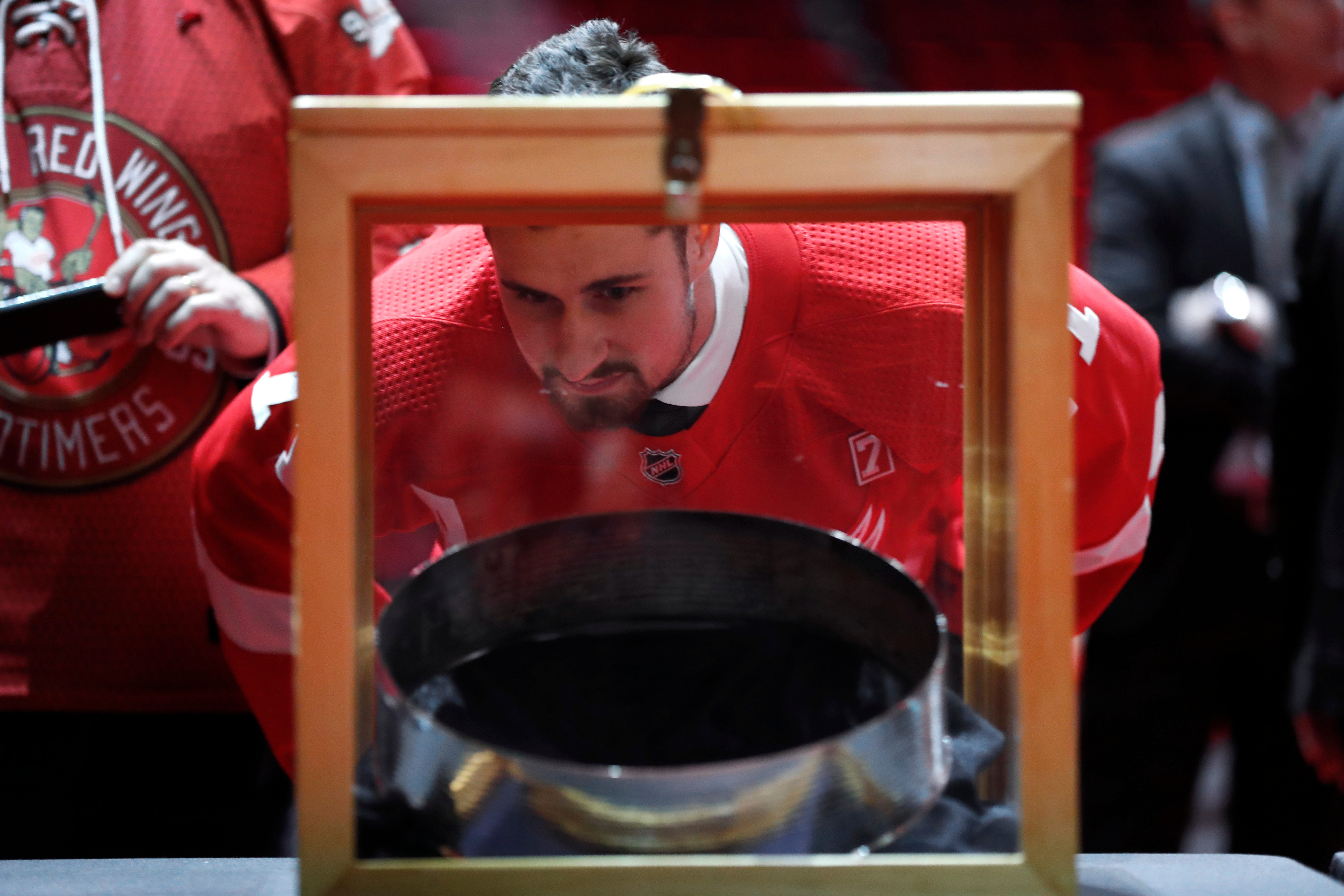 Detroit Red Wings center Dylan Larkin views a ring of the Stanley Cup during the public viewing. Every 12 years a ring is removed from the Stanley Cup, to make room for the names of new champions.