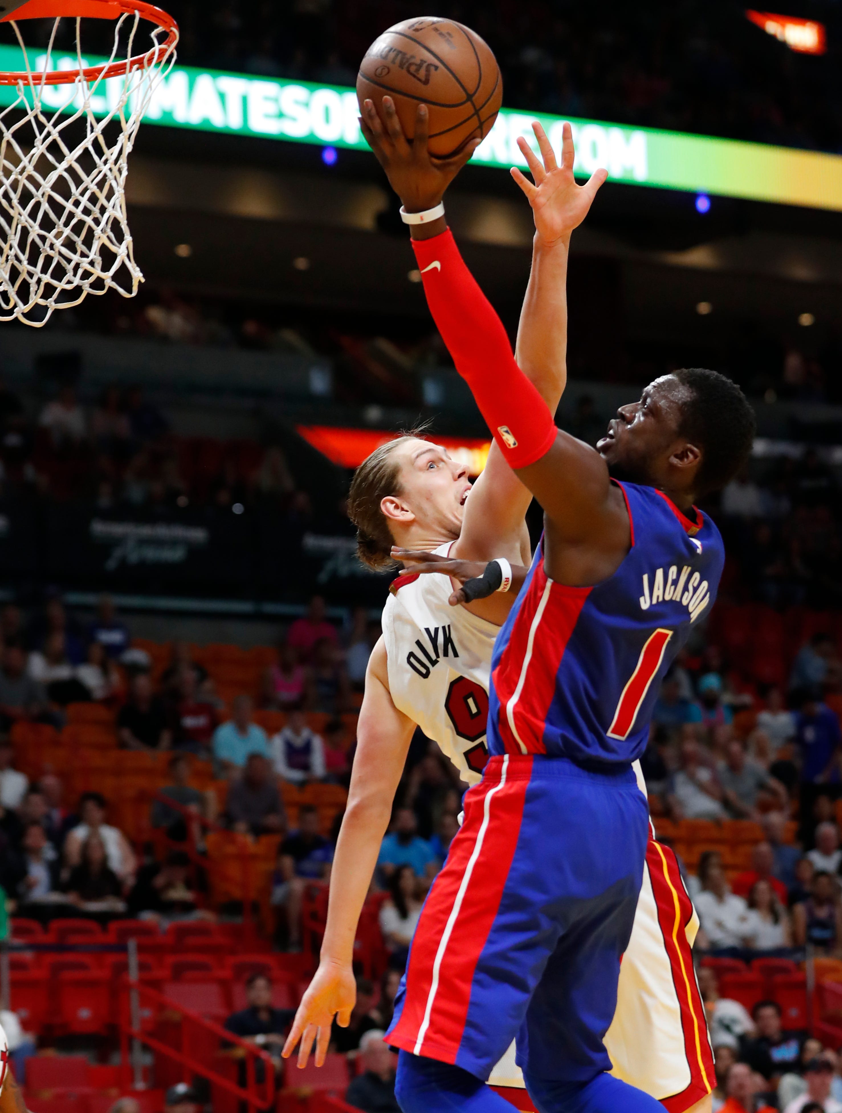 Detroit Pistons guard Reggie Jackson (1) shoots against Miami Heat forward Kelly Olynyk (9) during the first half.