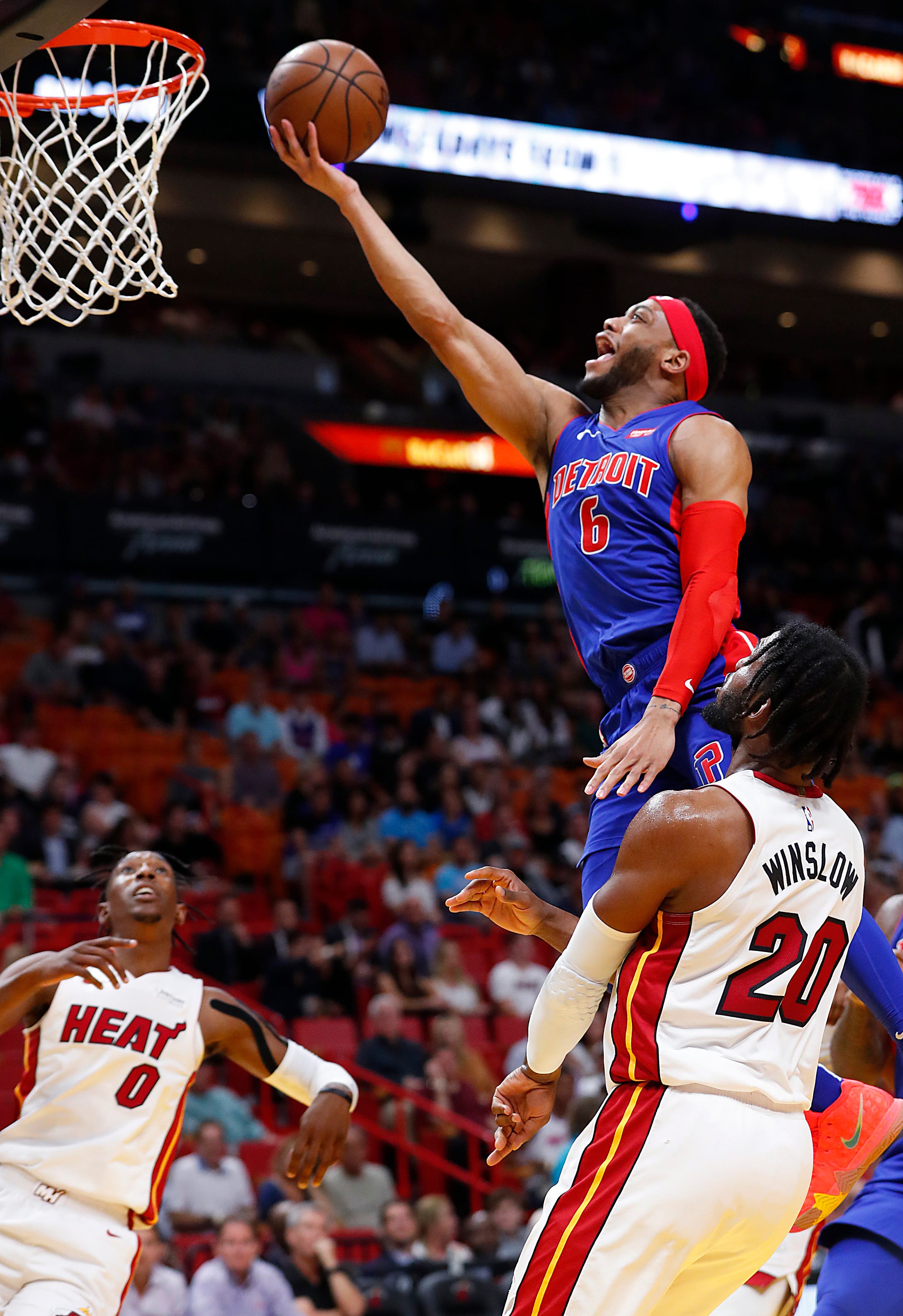Detroit Pistons guard Bruce Brown (6) shoots against Miami Heat forward Justise Winslow (20) and guard Josh Richardson (0) during the first half.