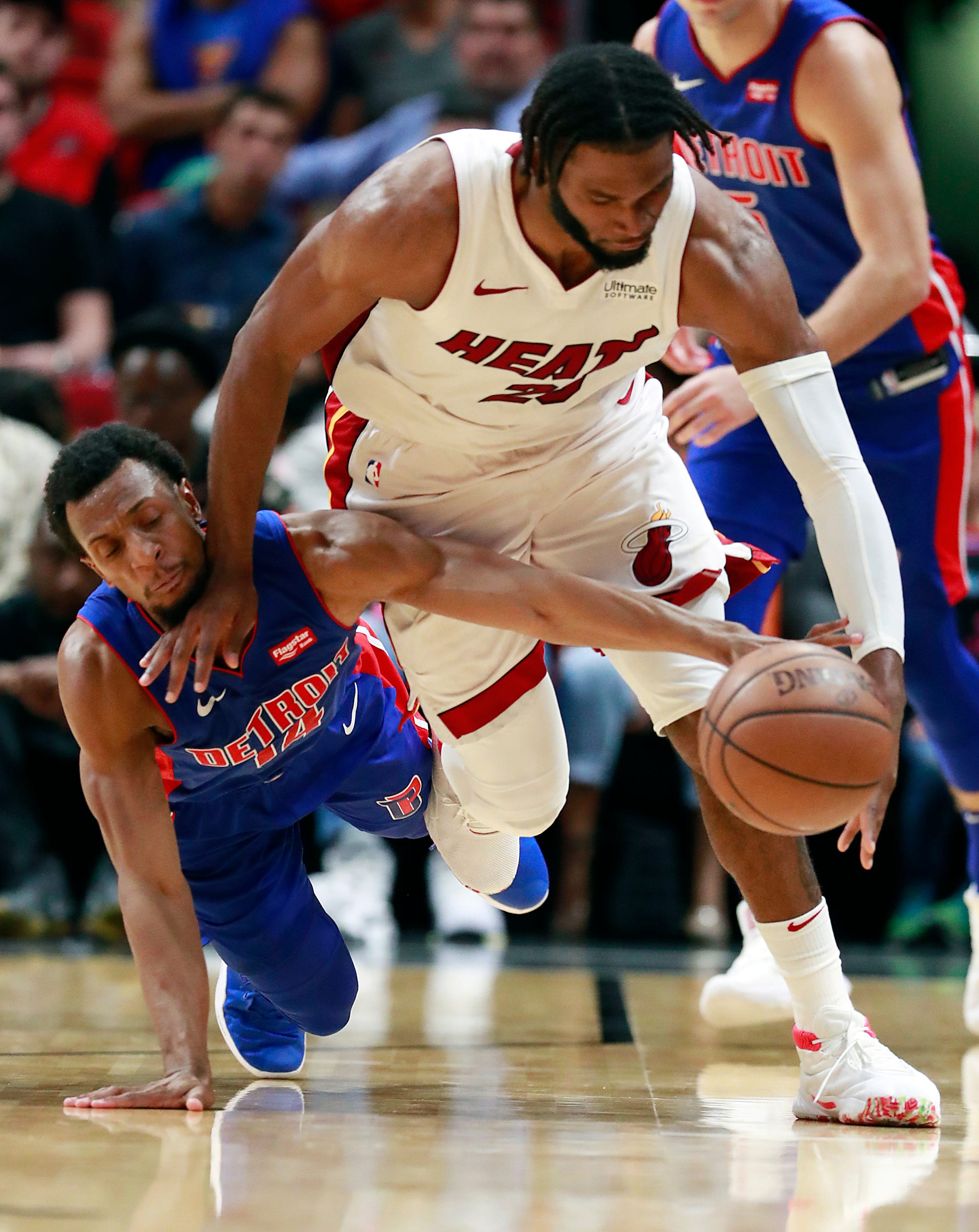 Miami Heat forward Justise Winslow, right, and Detroit Pistons guard Ish Smith battle for a loose ball during the second half.