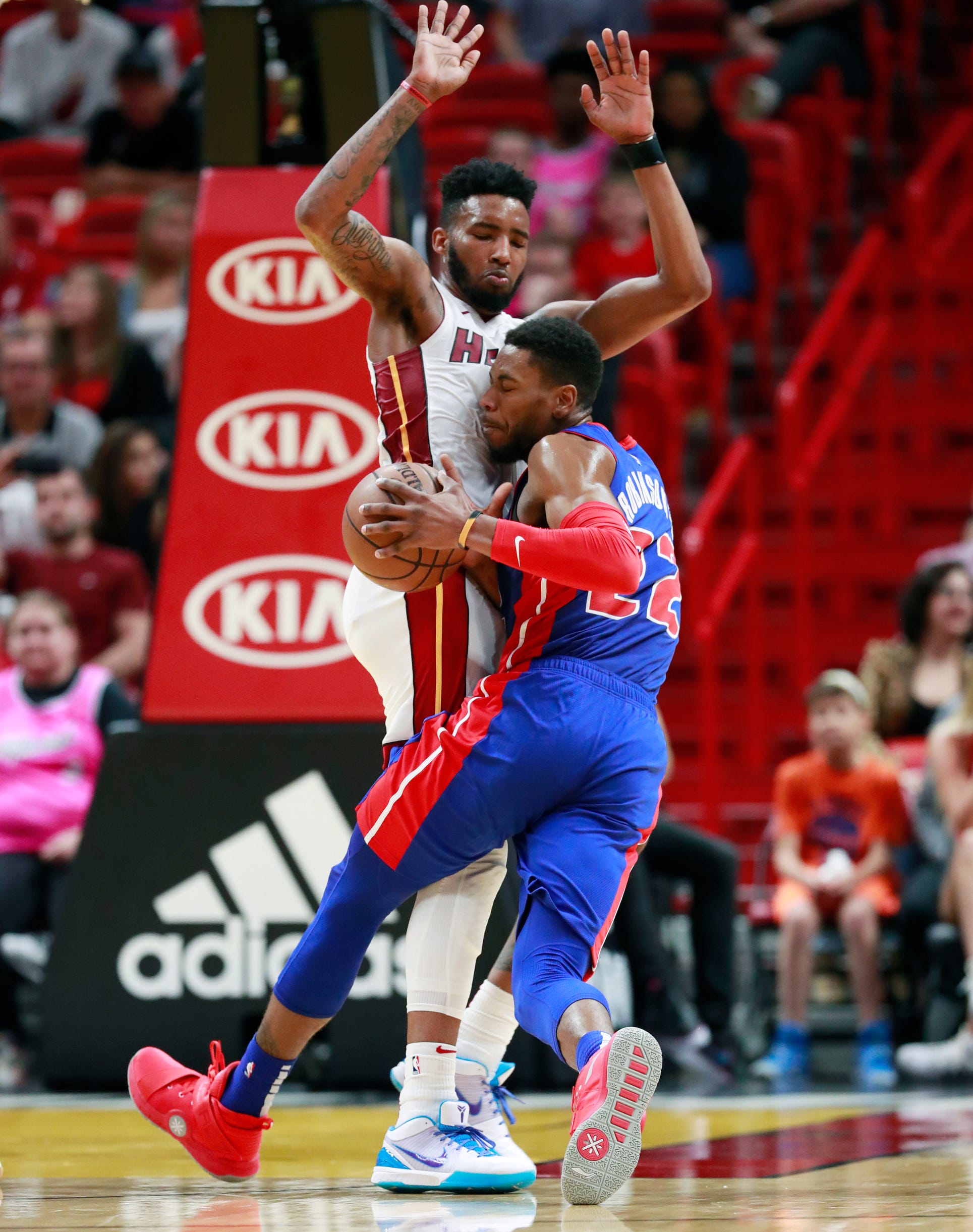 Detroit Pistons guard Glenn Robinson III (22) collides with Miami Heat forward Derrick Jones Jr. as he drives to the basket during the second half.