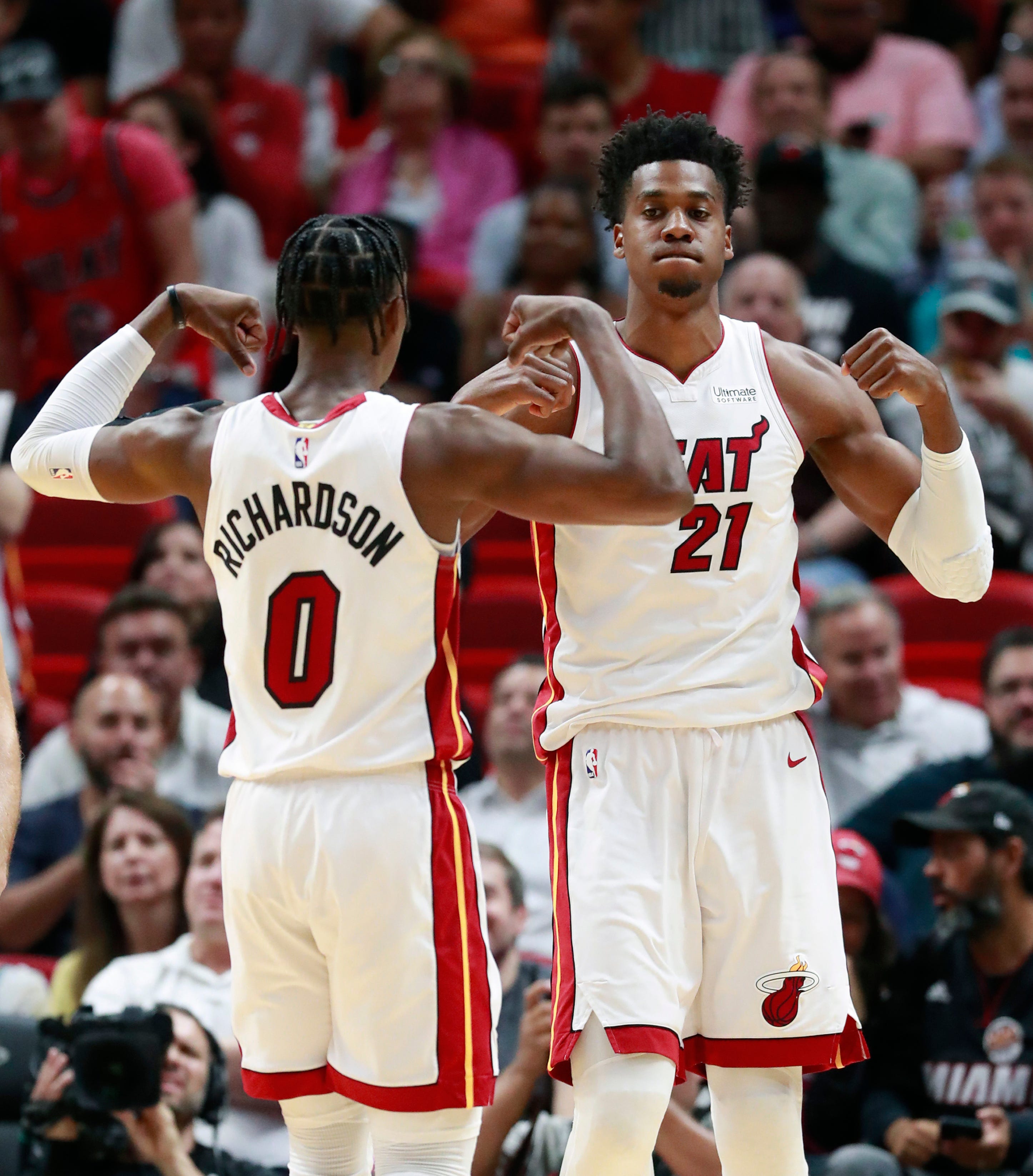 Miami Heat center Hassan Whiteside (21) and guard Josh Richardson (0) celebrate after Whiteside scored during the first half.