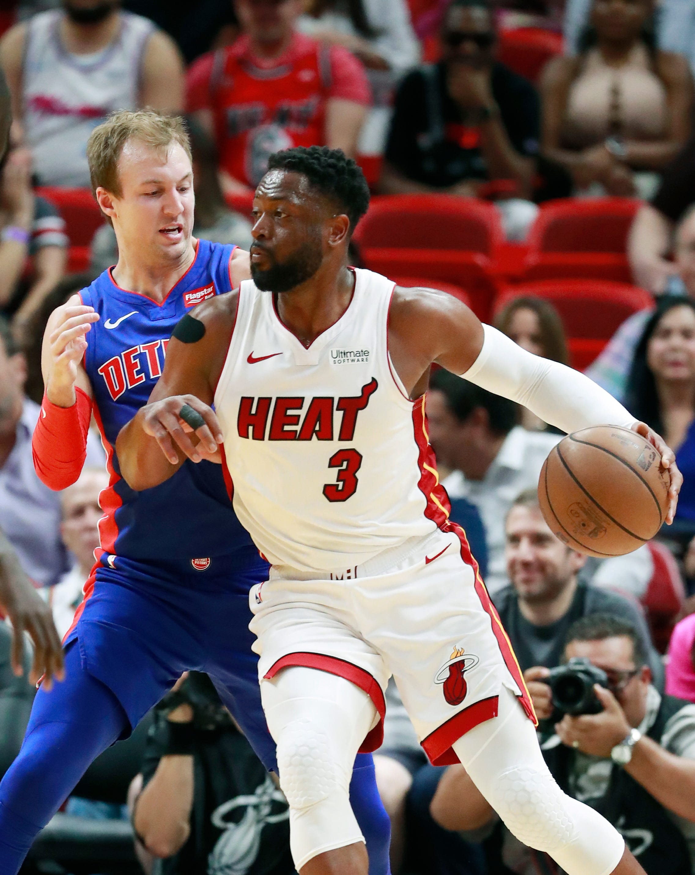 Miami Heat guard Dwyane Wade (3) drives against Detroit Pistons guard Luke Kennard during the first half on Wednesday, March 13, 2019, in Miami, Florida.