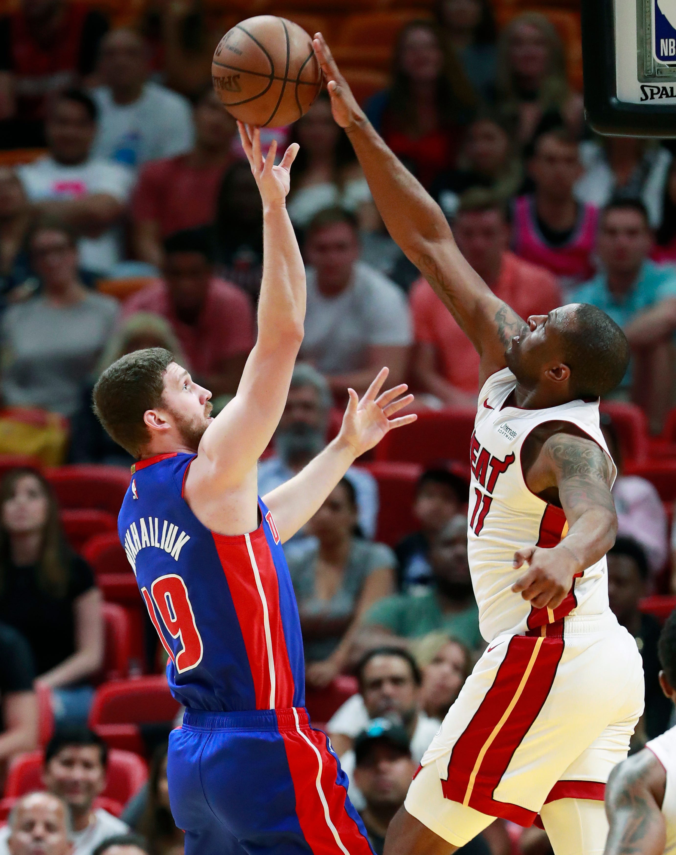 Miami Heat guard Dion Waiters (11) swats a shot away from Detroit Pistons guard Sviatoslav Mykhailiuk (19) during the second half.