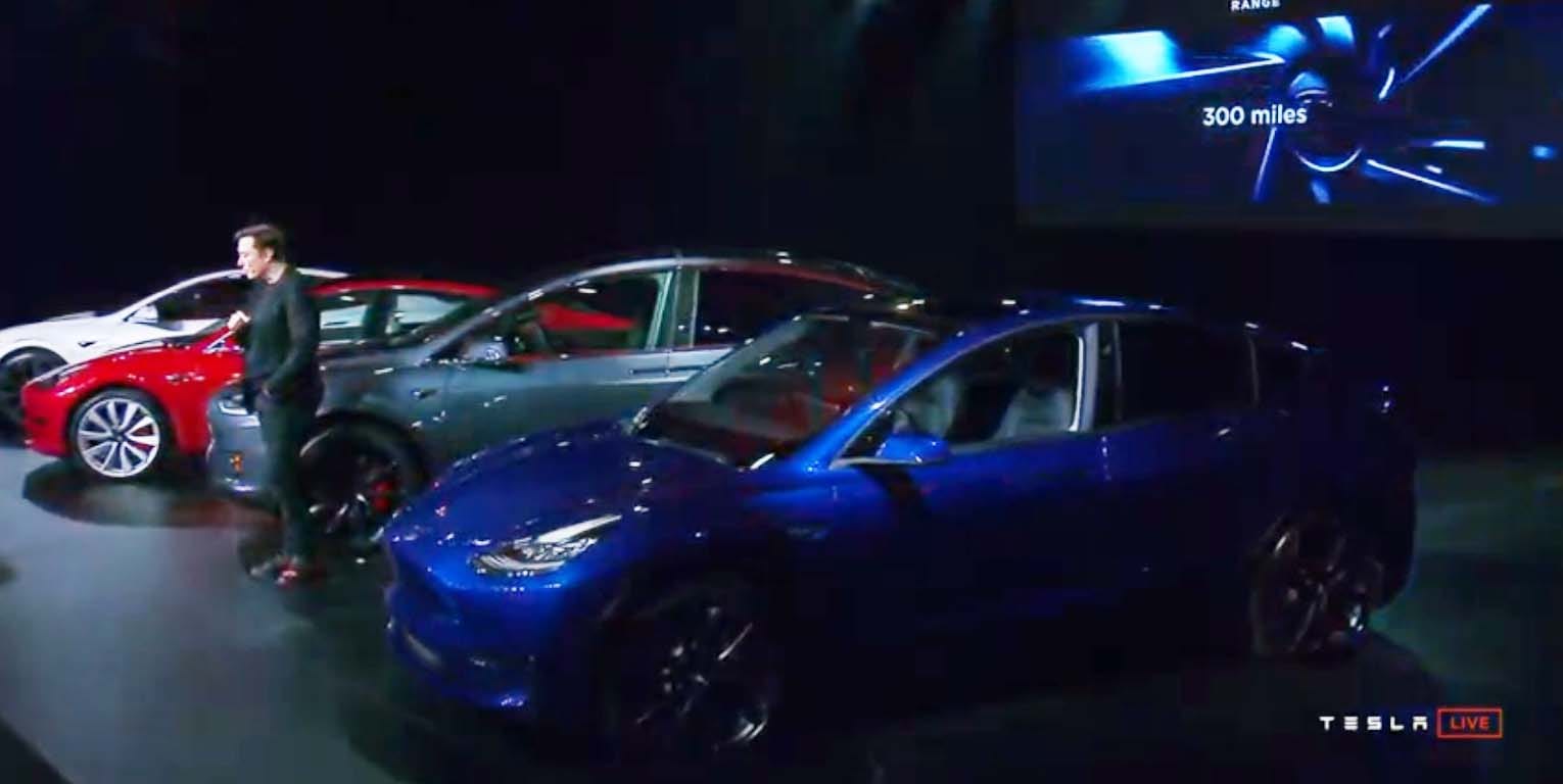Tesla CEO Elon Musk with his "S3XY" lineup of EVs: (from left) Model S, MOdel 3, Model X, and Model Y. "We are bringing sexy back!" reveled Musk at his LA news conference.