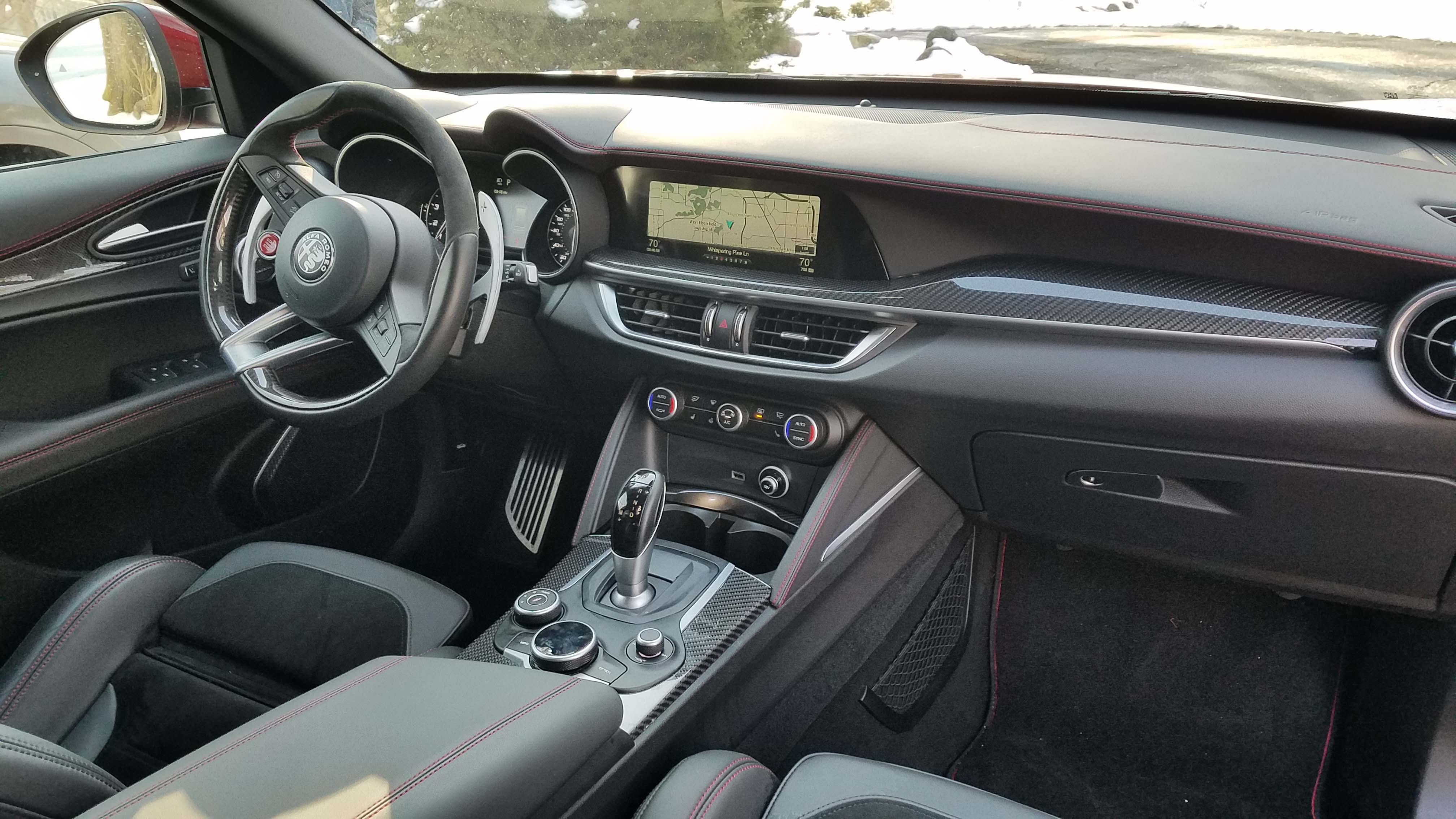 The Alfa Romeo Stelvio Quadrifoglio has a unique interior with remote-rotary controlled touchscreen and big analog gauges.