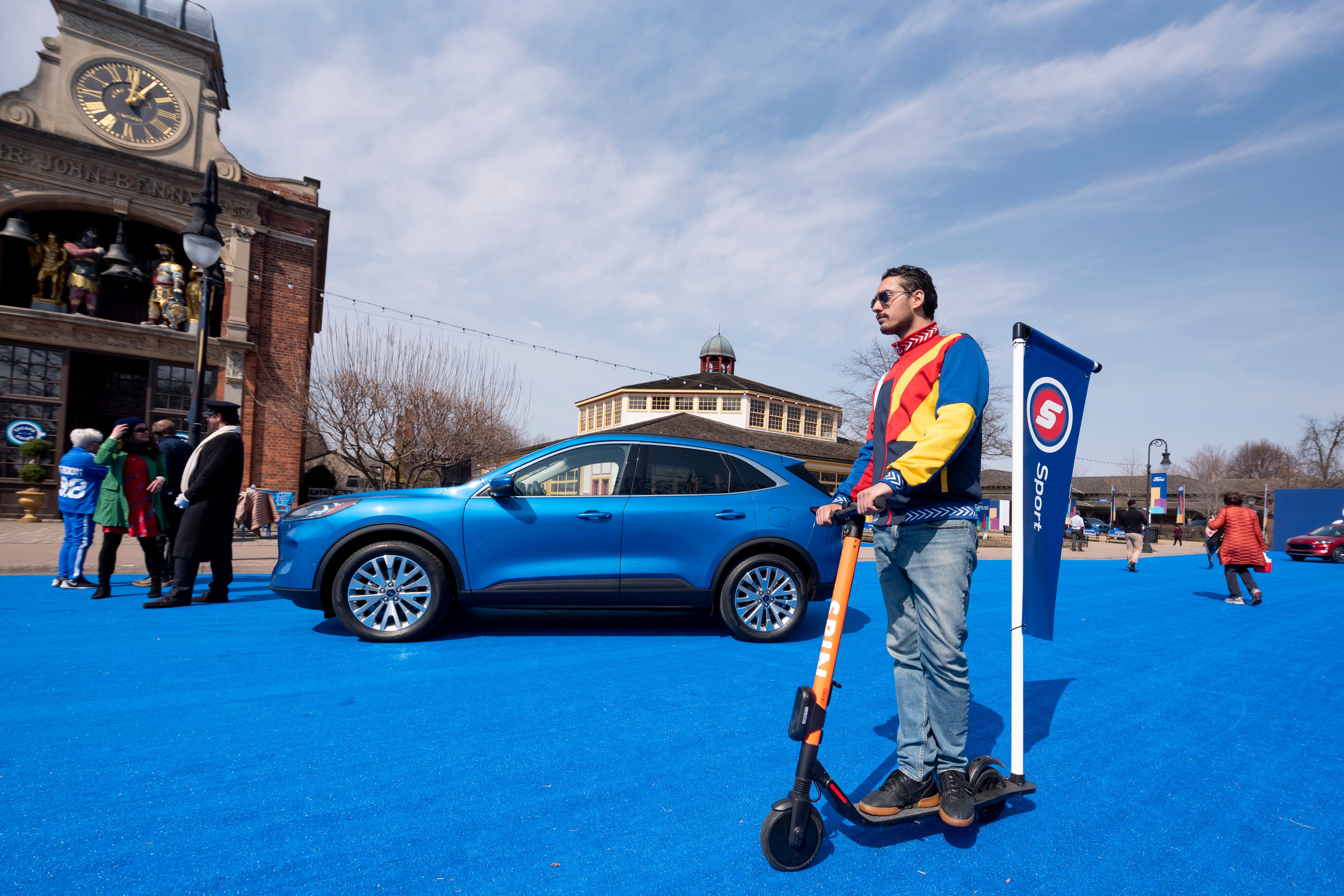 Performers, artists and journalists roam Greenfield Village during a reveal of the 2020 Ford Escape, in Dearborn.
