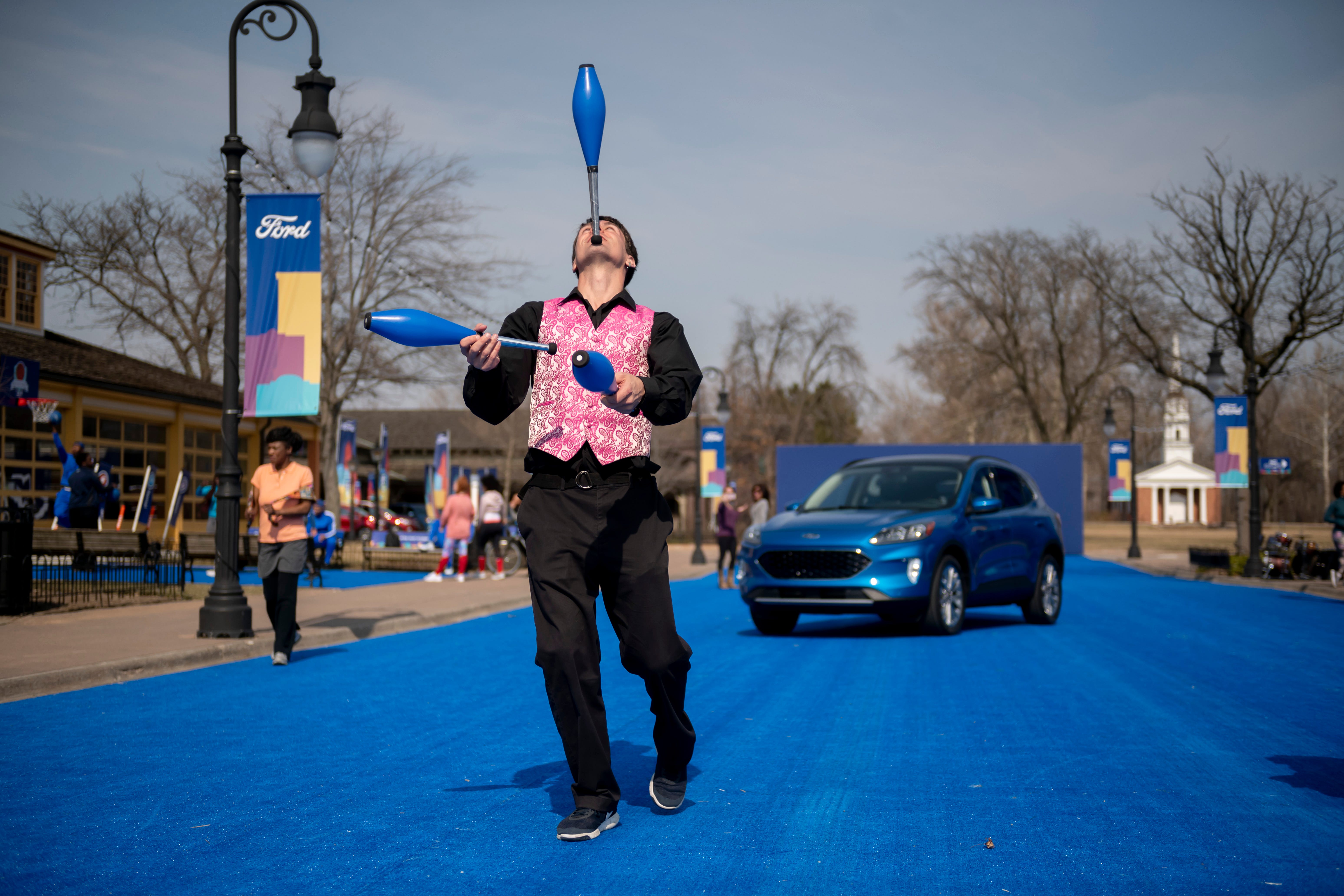 Professional juggler Chuck Clark performs during a reveal of the 2020 Ford Escape, at Greenfield Village.