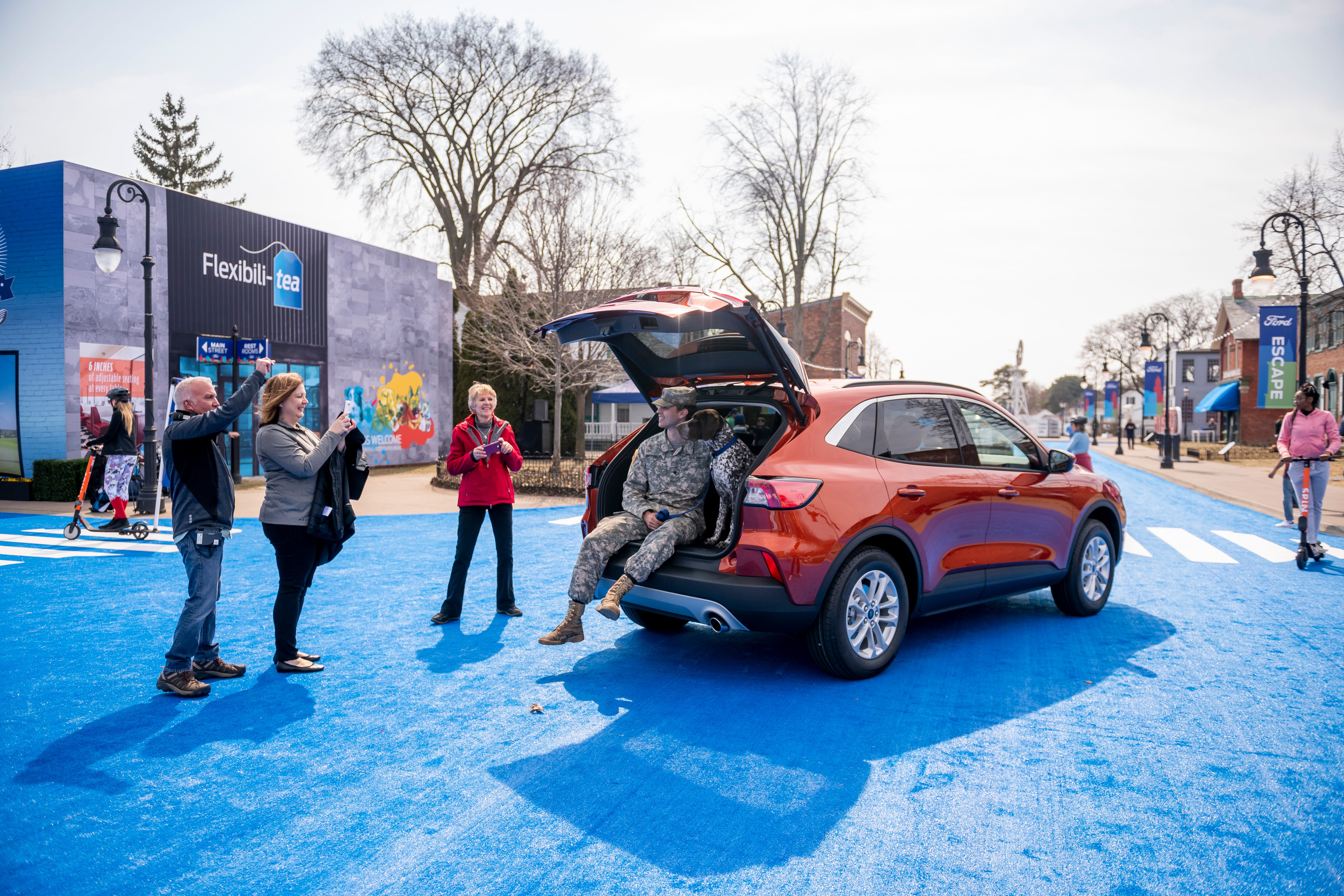 Performers, artists and actors spend time with the 2020 Ford Escape during a reveal of the vehicle at Greenfield Village, in Dearborn.