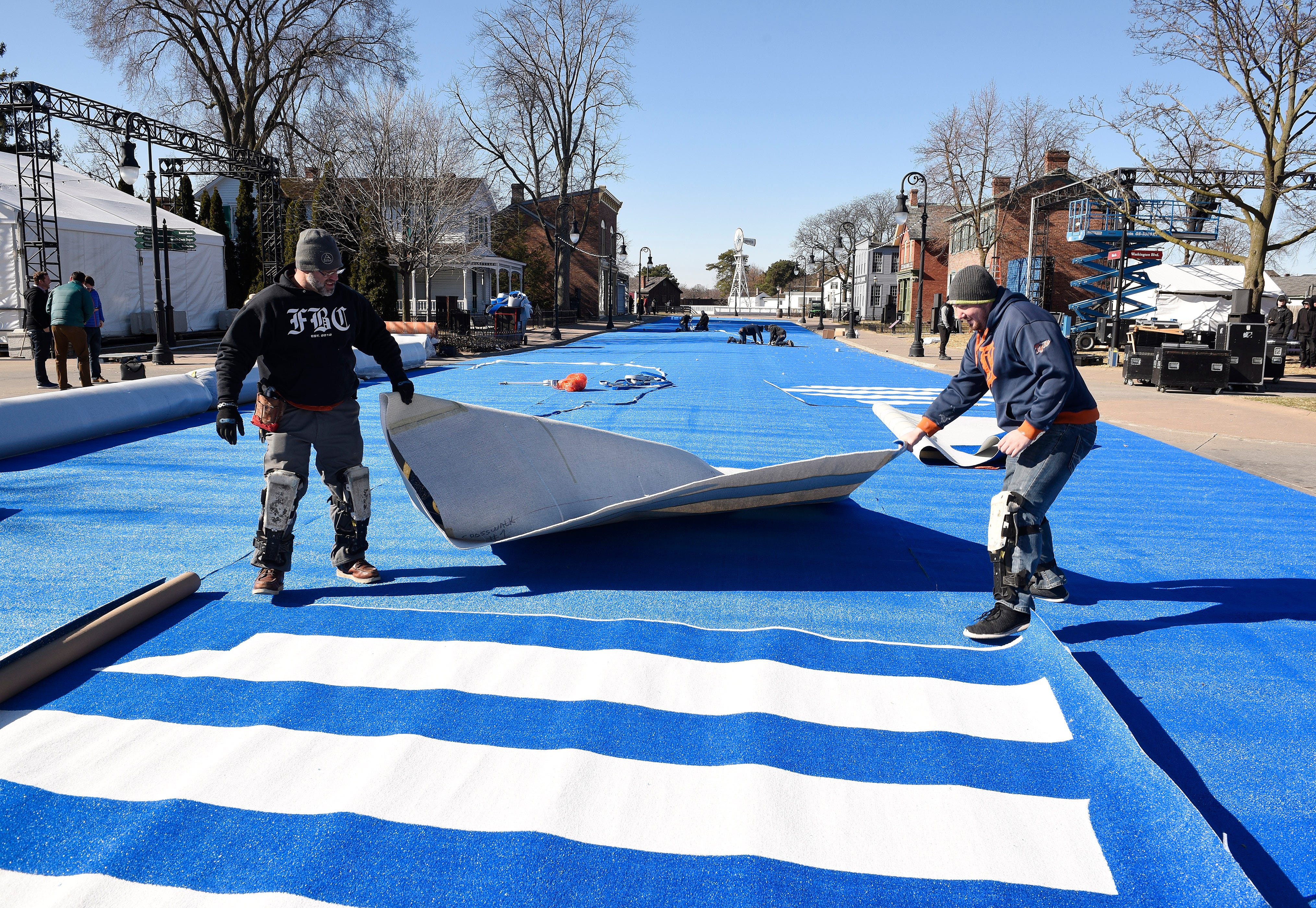 Days before the event,  Matt Rattray, left,  and Andy Barker of D.E. McNabb Flooring Co. were among the crew that installed carpeting at Greenfield Village in Dearborn, where Ford Motor Co. created "Escapeville" to unveil its brand new Escape global crossover vehicle.