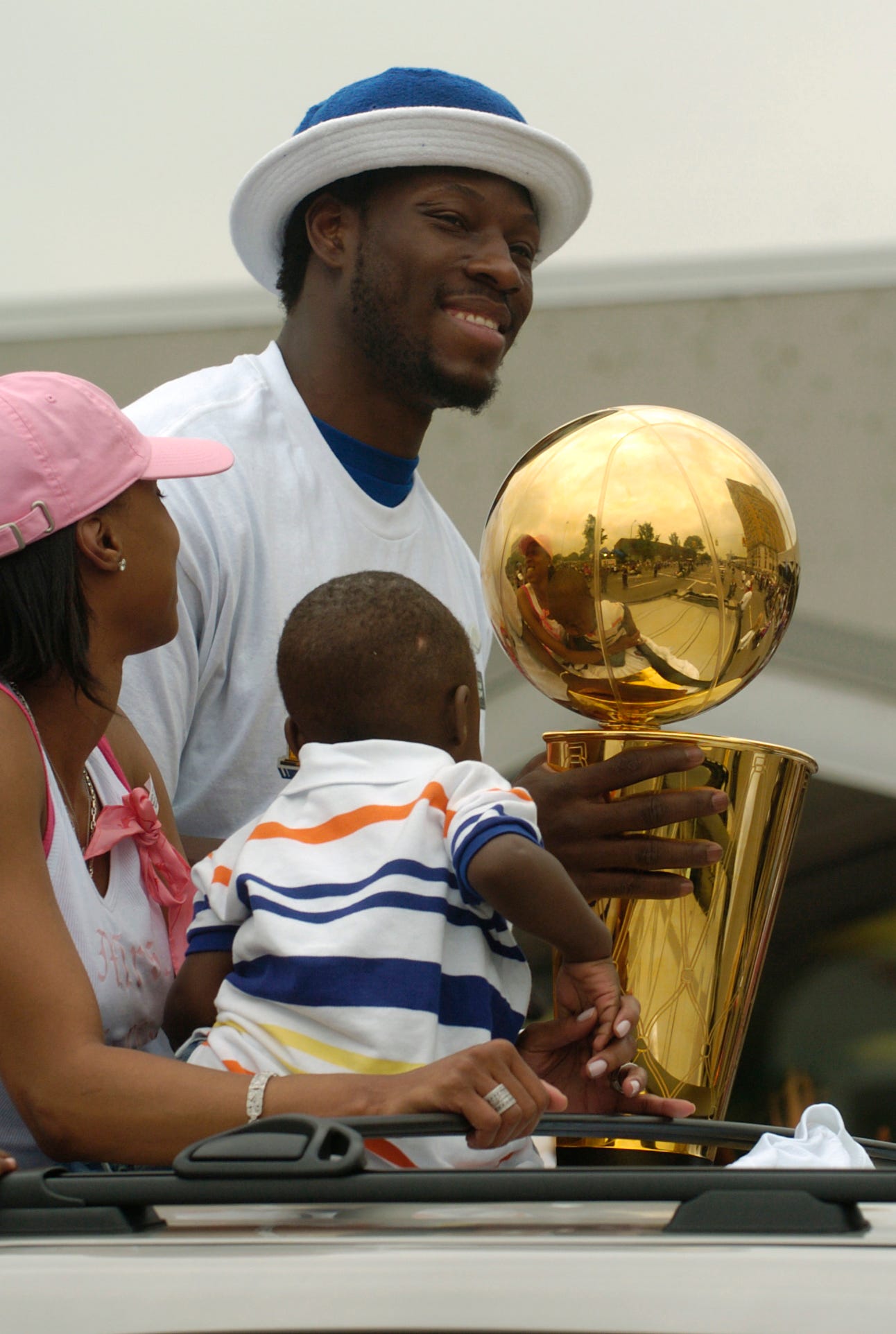 Ben Wallace with his family and the championship trophy in the parade.