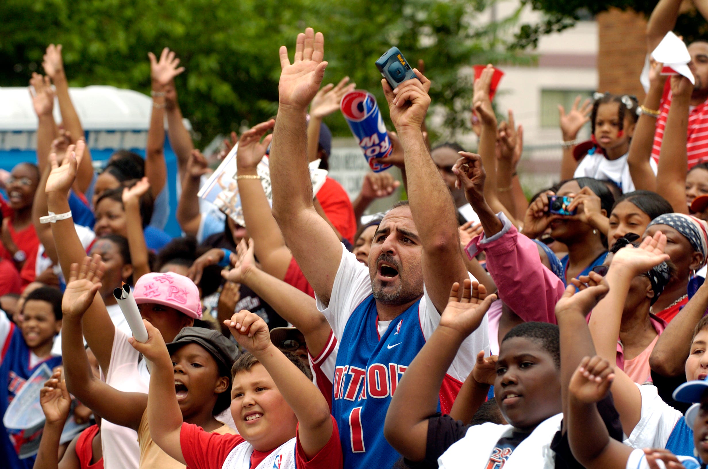 Thousands of fans line Jefferson Avenue to cheer the 2004 NBA champion Detroit Pistons.