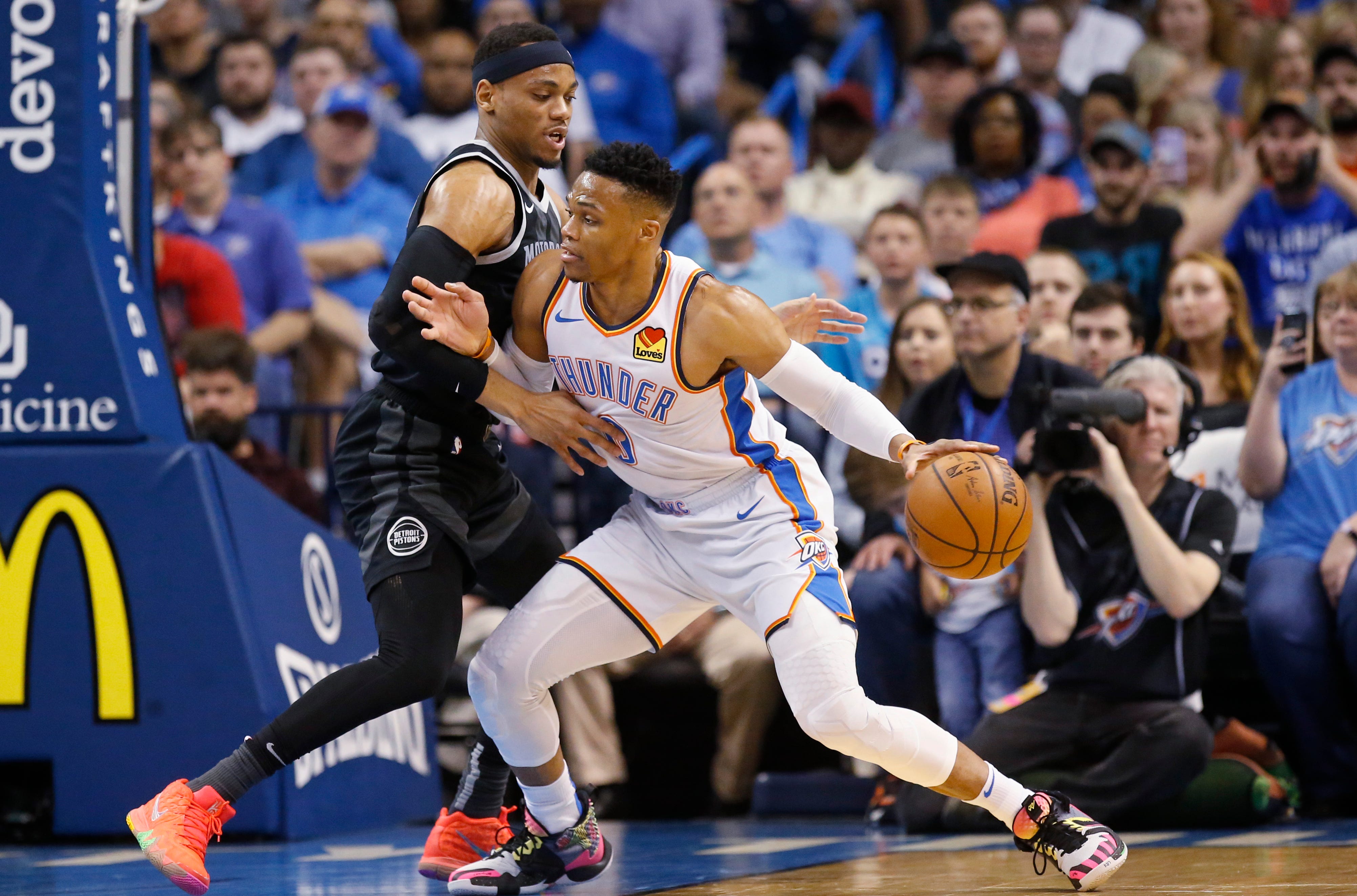Oklahoma City Thunder guard Russell Westbrook, right, drives against Detroit Pistons guard Bruce Brown during the first half.