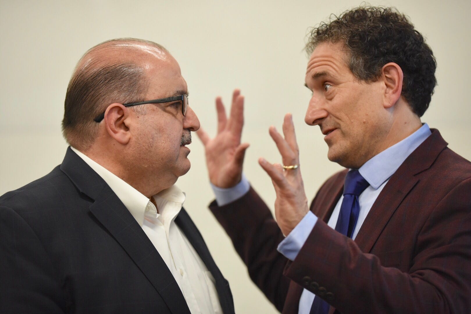 Rep. Andy Levin (right) speaks with Sam Hamana during a meeting concerning the Iraqi deportations at the Chaldean Community Center on Saturday, April 6, 2019.