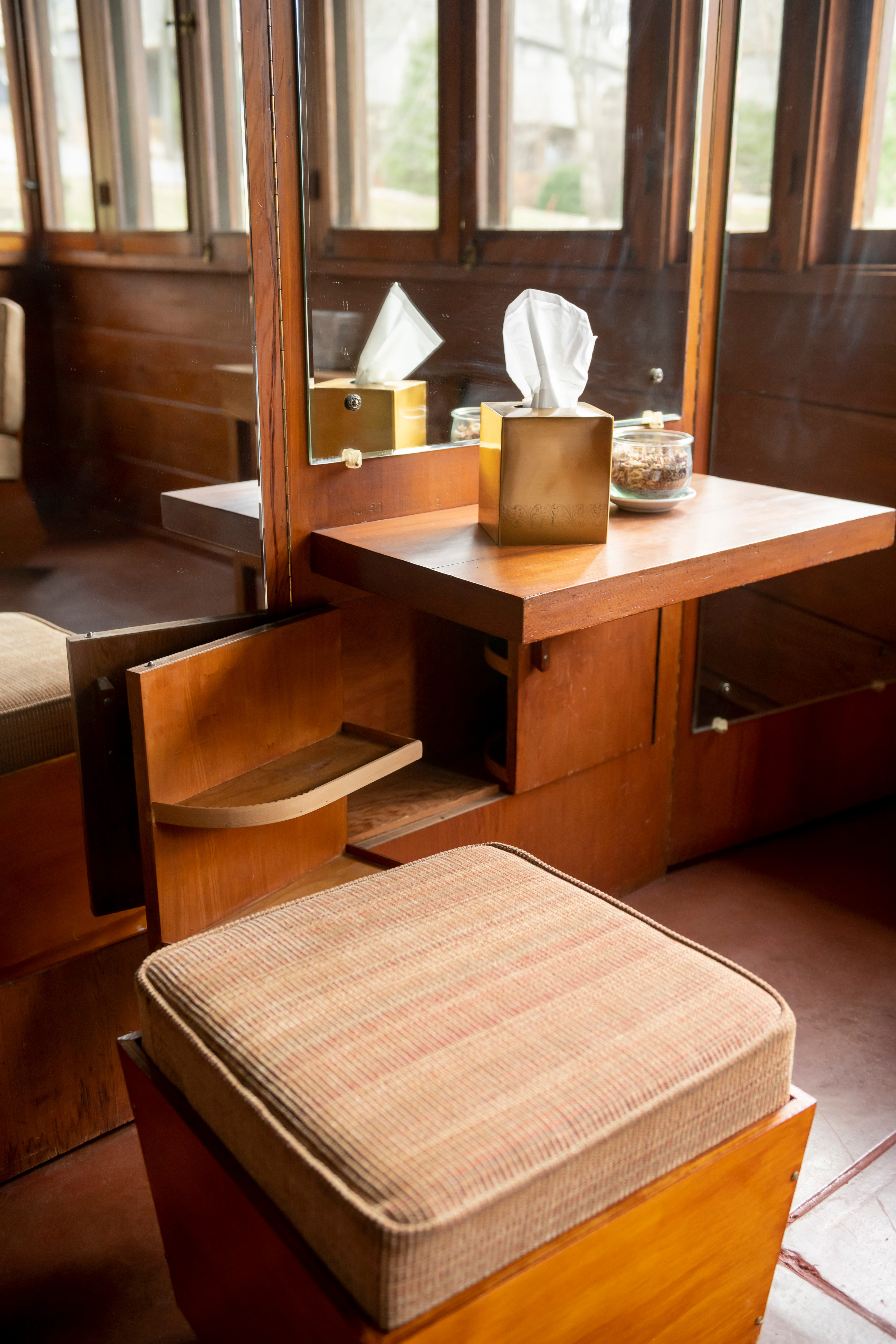 A vanity in the master bedroom includes a hidden storage compartment.