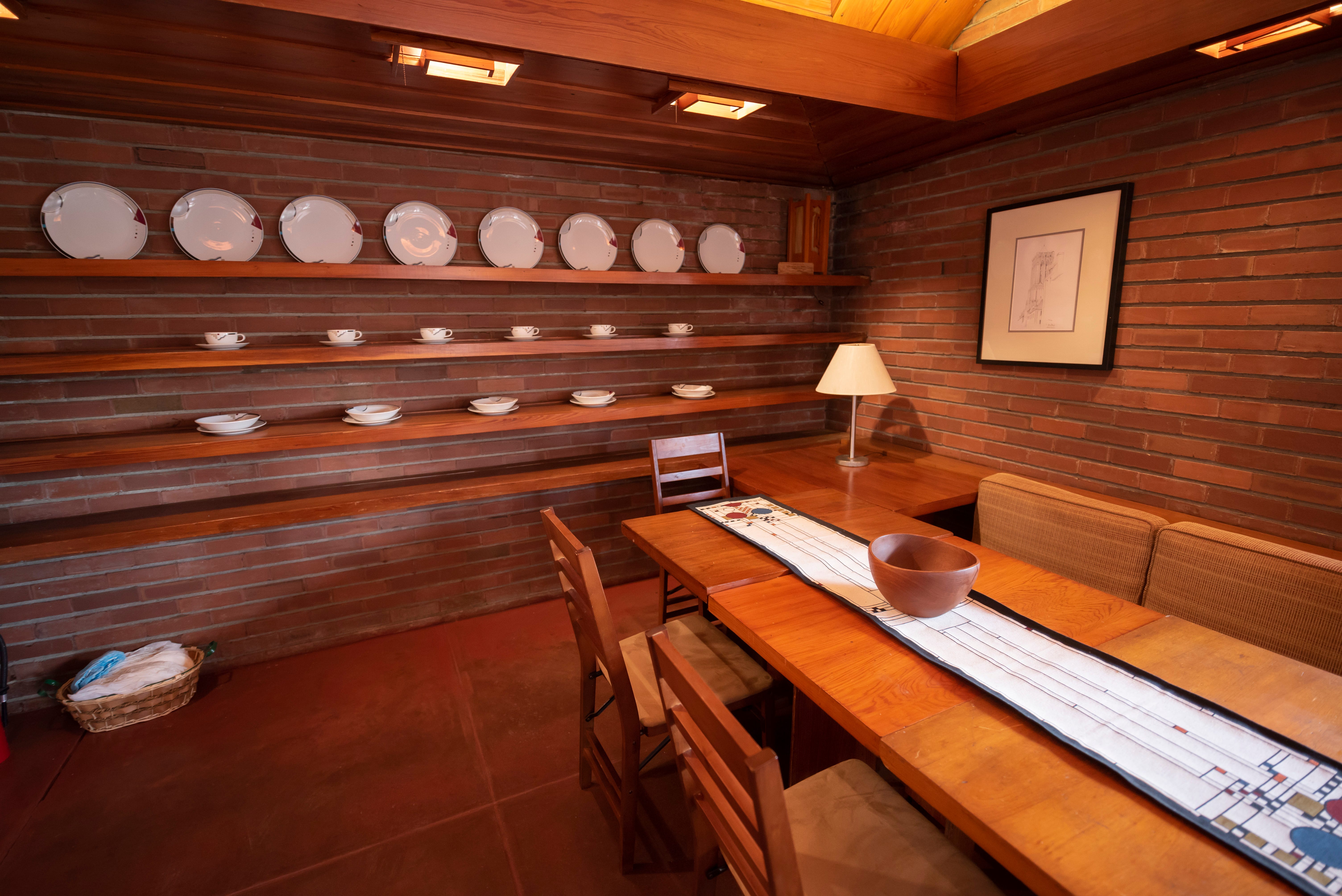 The dining area including shelves built by Wright to display dinnerware.