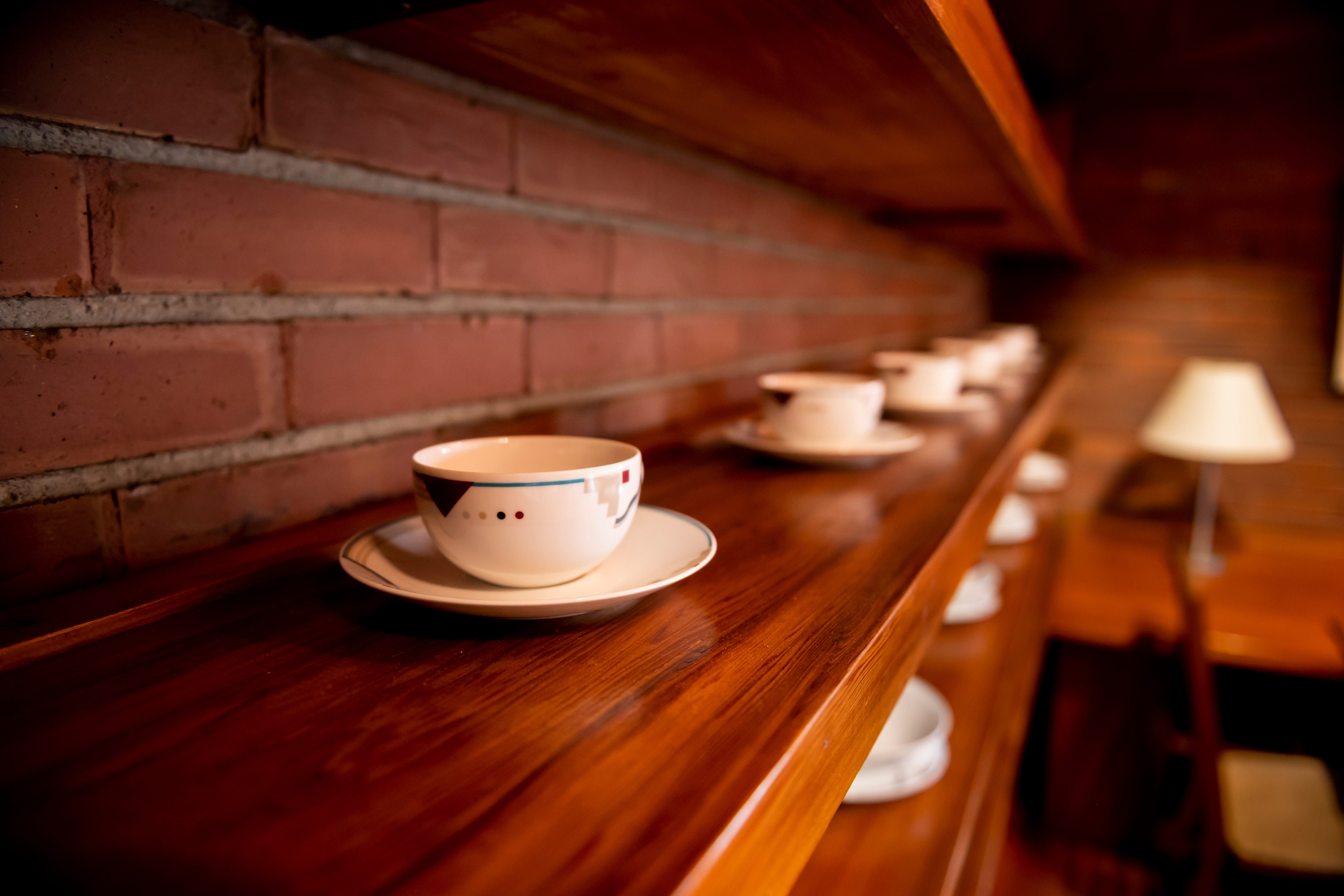 The dining area includes shelves built by Wright to display dinnerware.