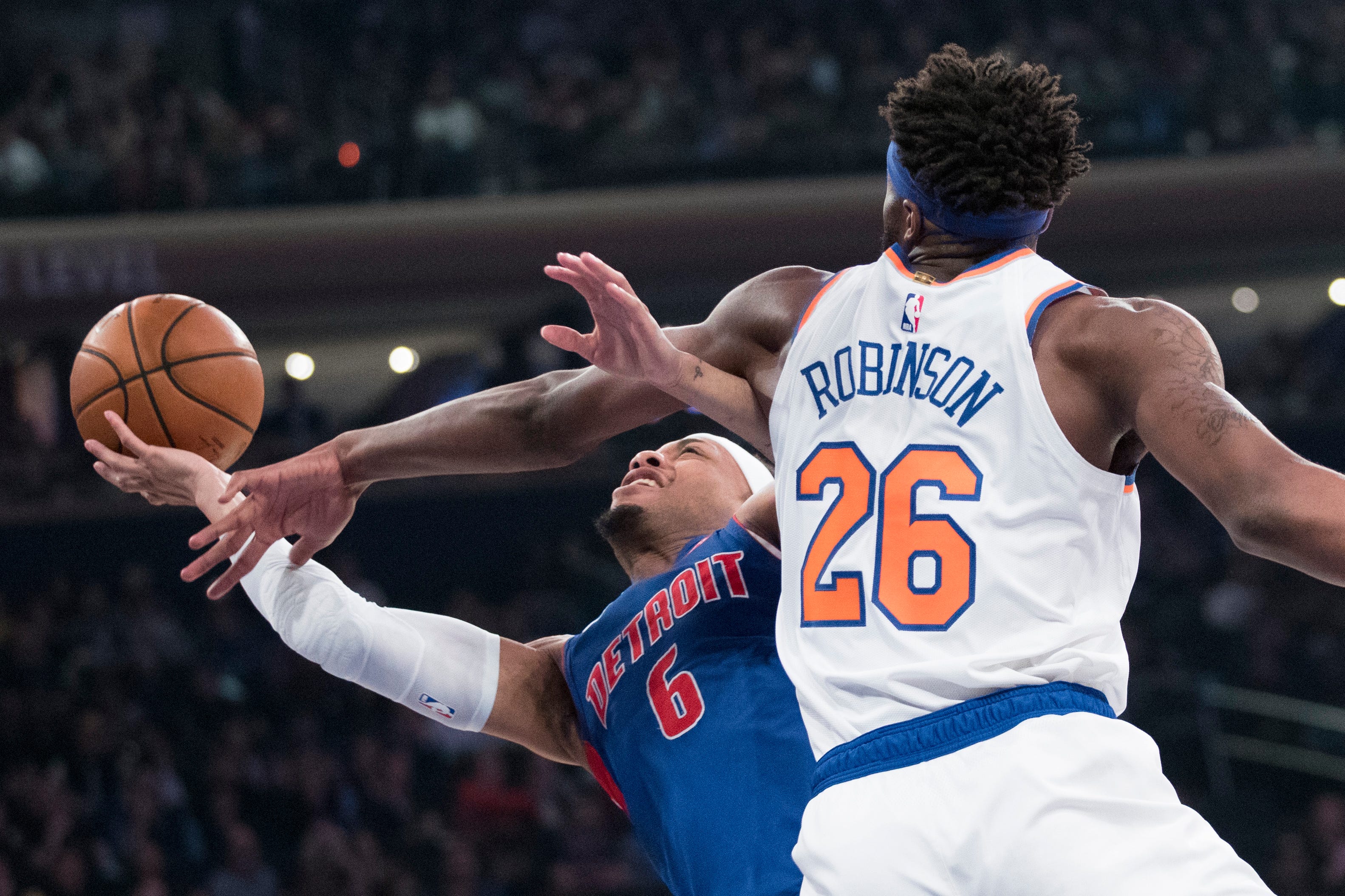 New York Knicks center Mitchell Robinson (26) fouls Detroit Pistons guard Bruce Brown (6) during the first half of their game Wednesday, April 10, 2019, at Madison Square Garden in New York. The Pistons win, 115-89.