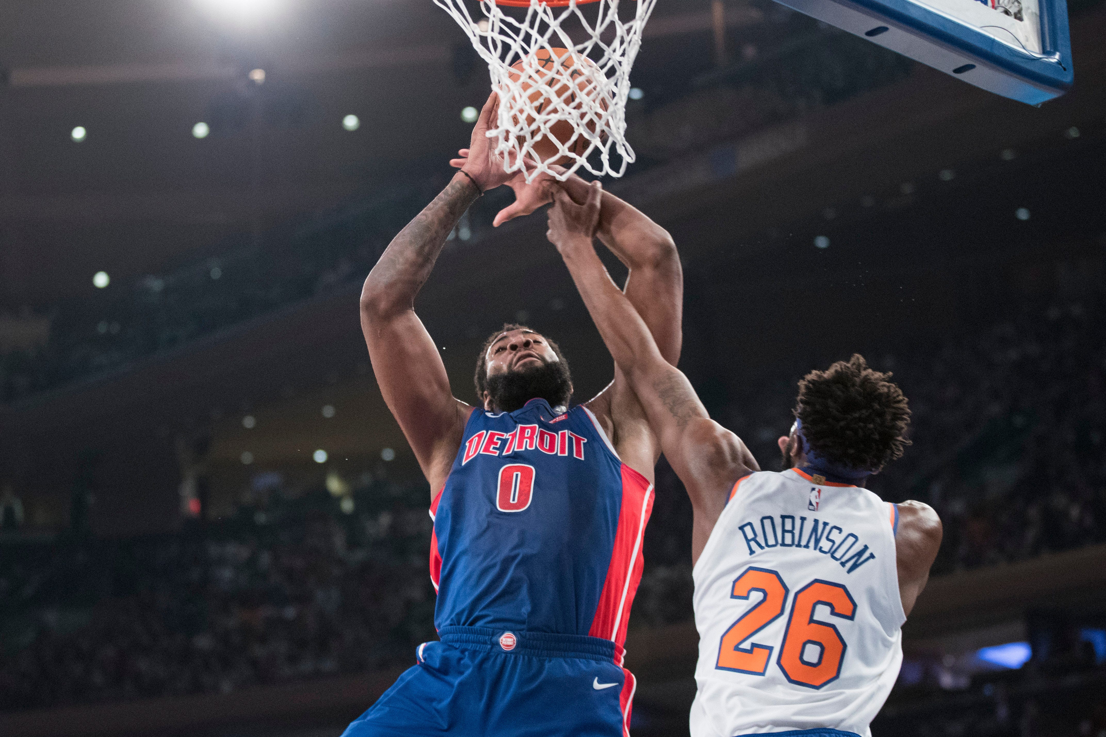Detroit Pistons center Andre Drummond (0) goes to the basket against New York Knicks center Mitchell Robinson (26) during the first half.