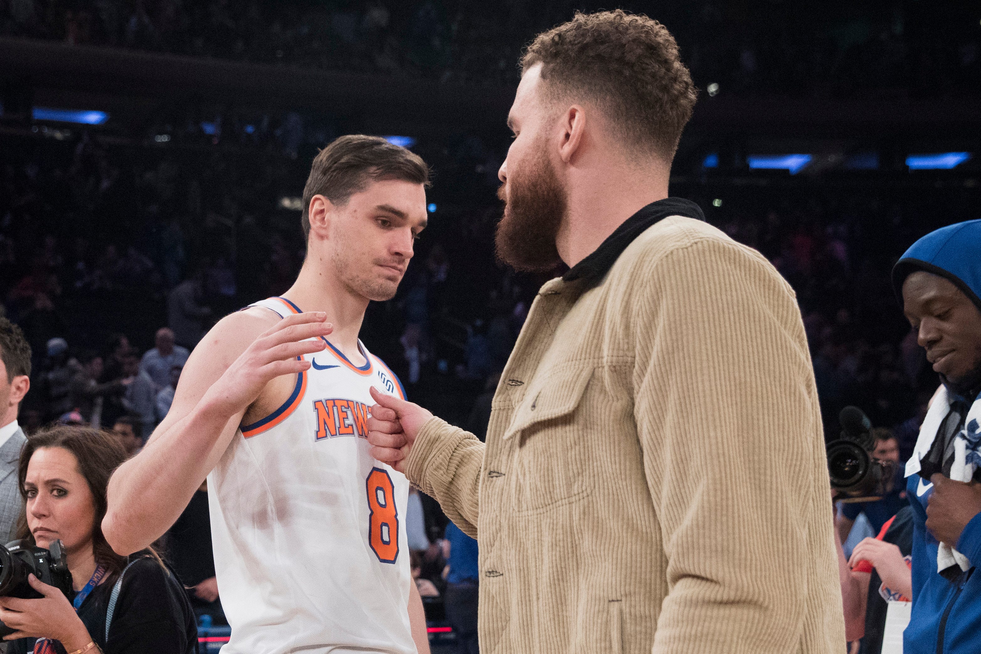 New York Knicks forward Mario Hezonja (8) greets Detroit Pistons forward Blake Griffin at the end of the game.