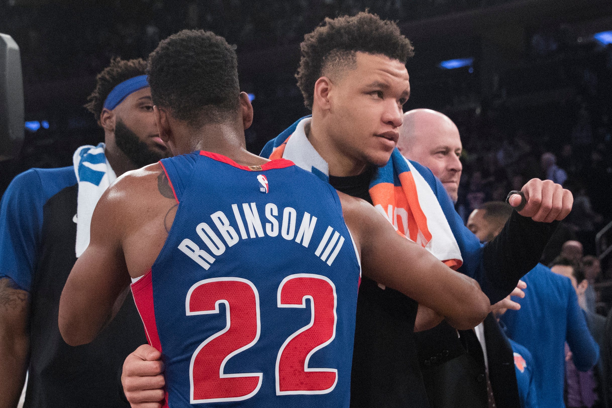 Detroit Pistons guard Glenn Robinson III (22) embraces New York Knicks forward Kevin Knox at the end of the game.