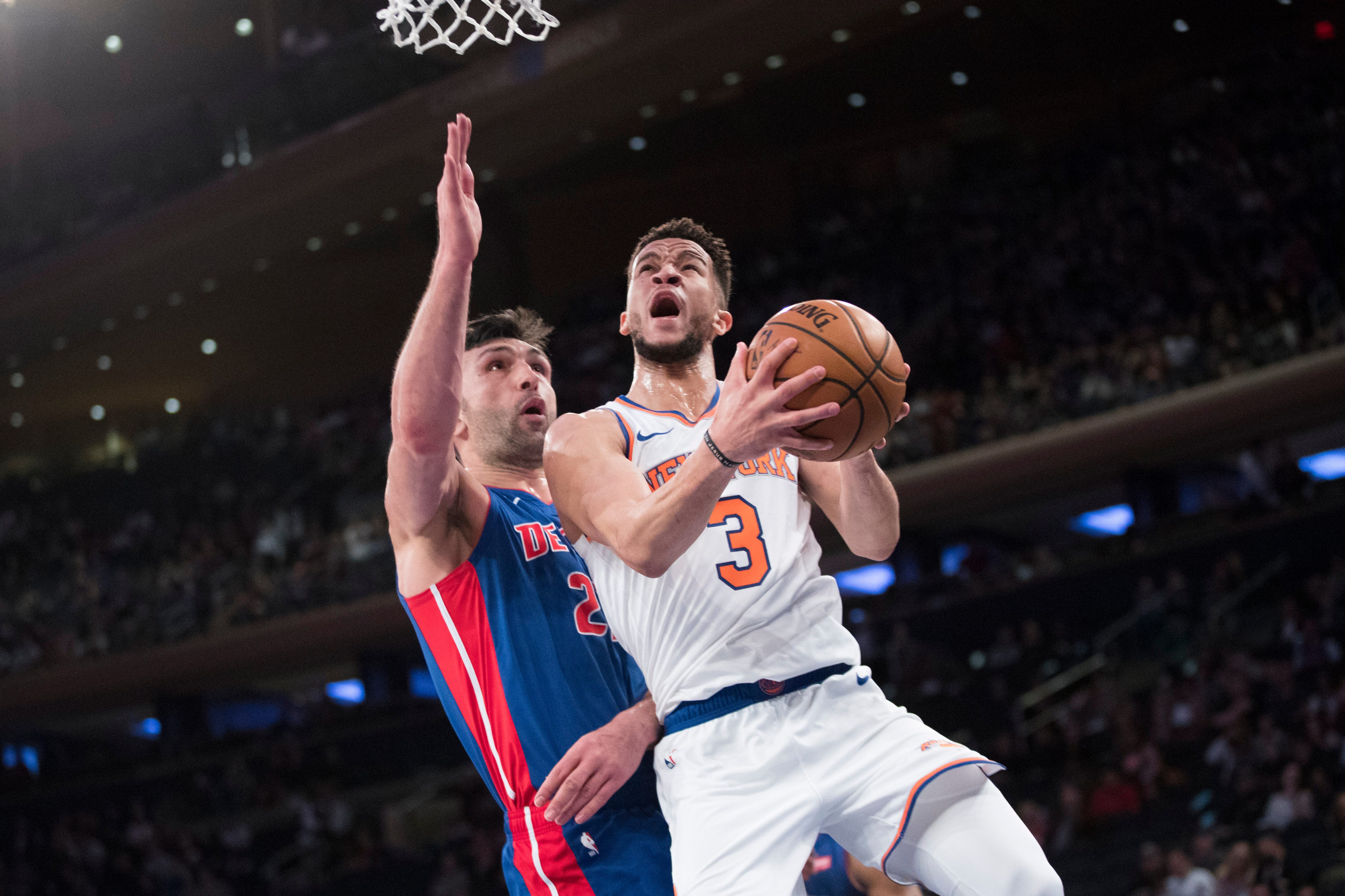 New York Knicks guard Billy Garrett Jr. (3) goes to the basket against Detroit Pistons center Zaza Pachulia during the second half.