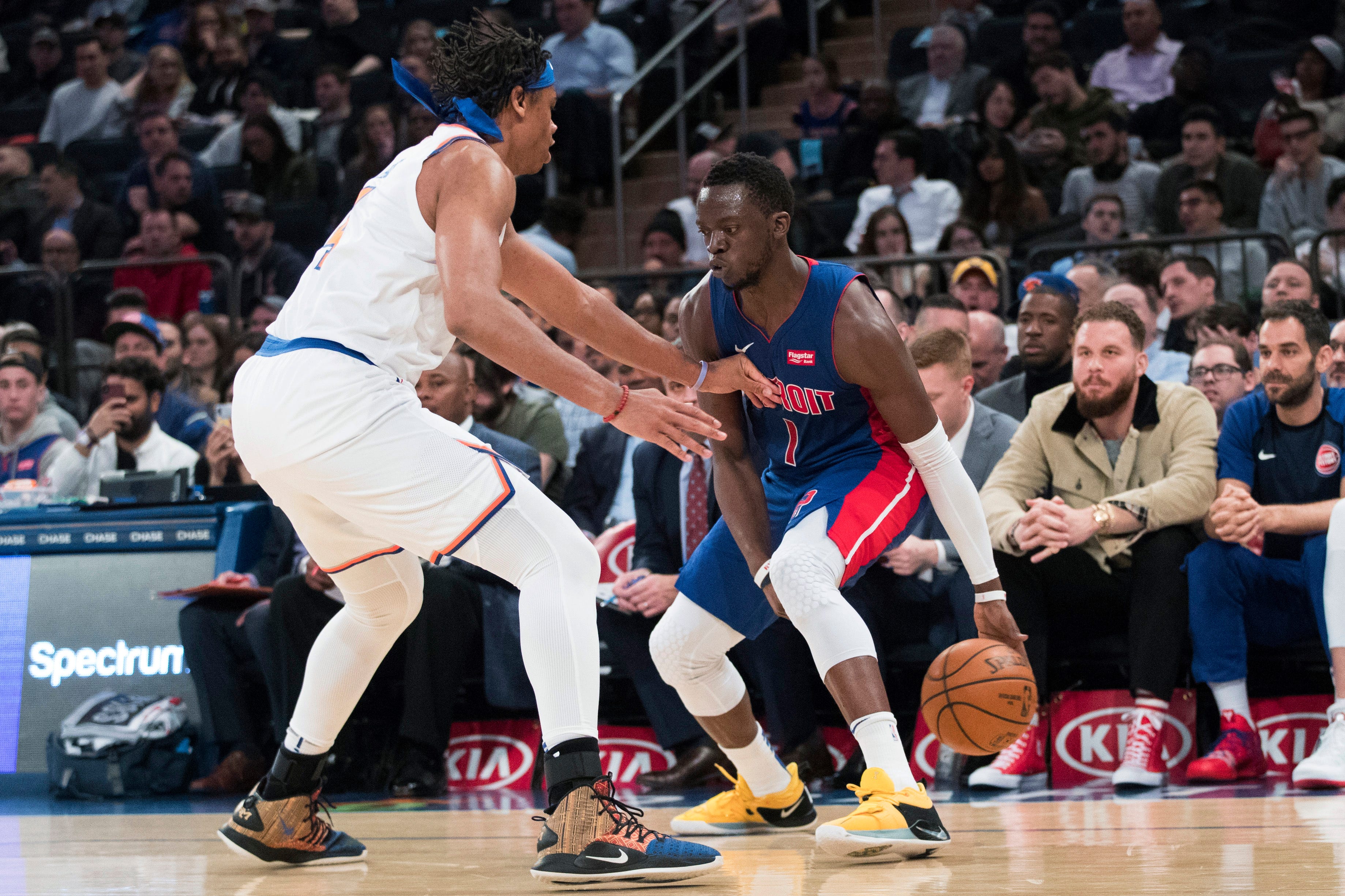 Detroit Pistons guard Reggie Jackson (1) drives against New York Knicks forward Isaiah Hicks during the first half.