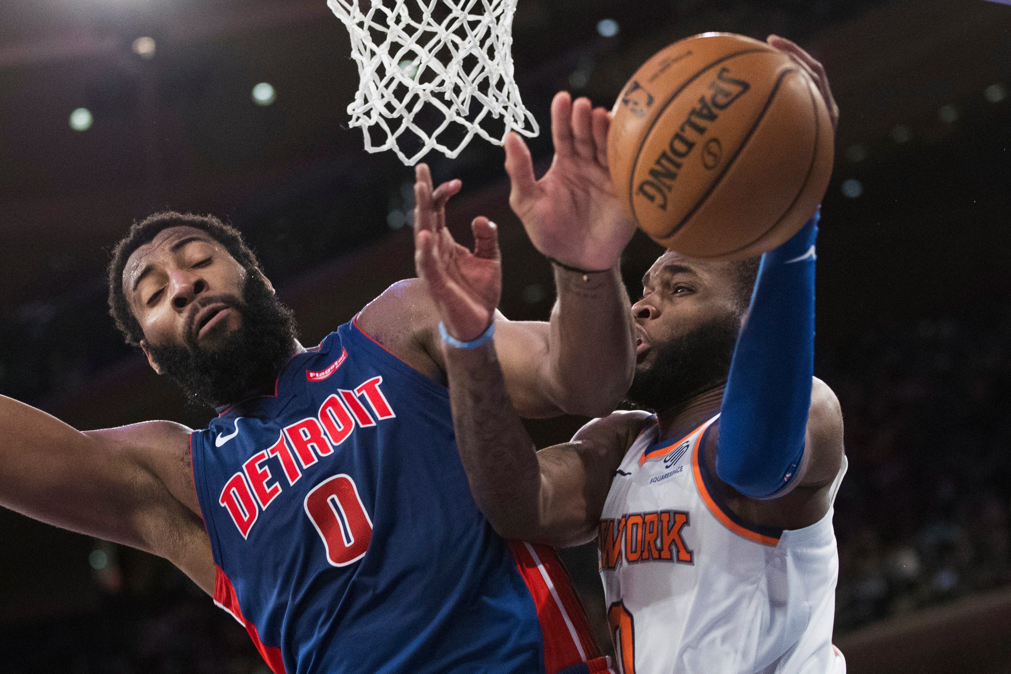 Detroit Pistons center Andre Drummond (0) fouls New York Knicks guard Kadeem Allen, right, during the second half.