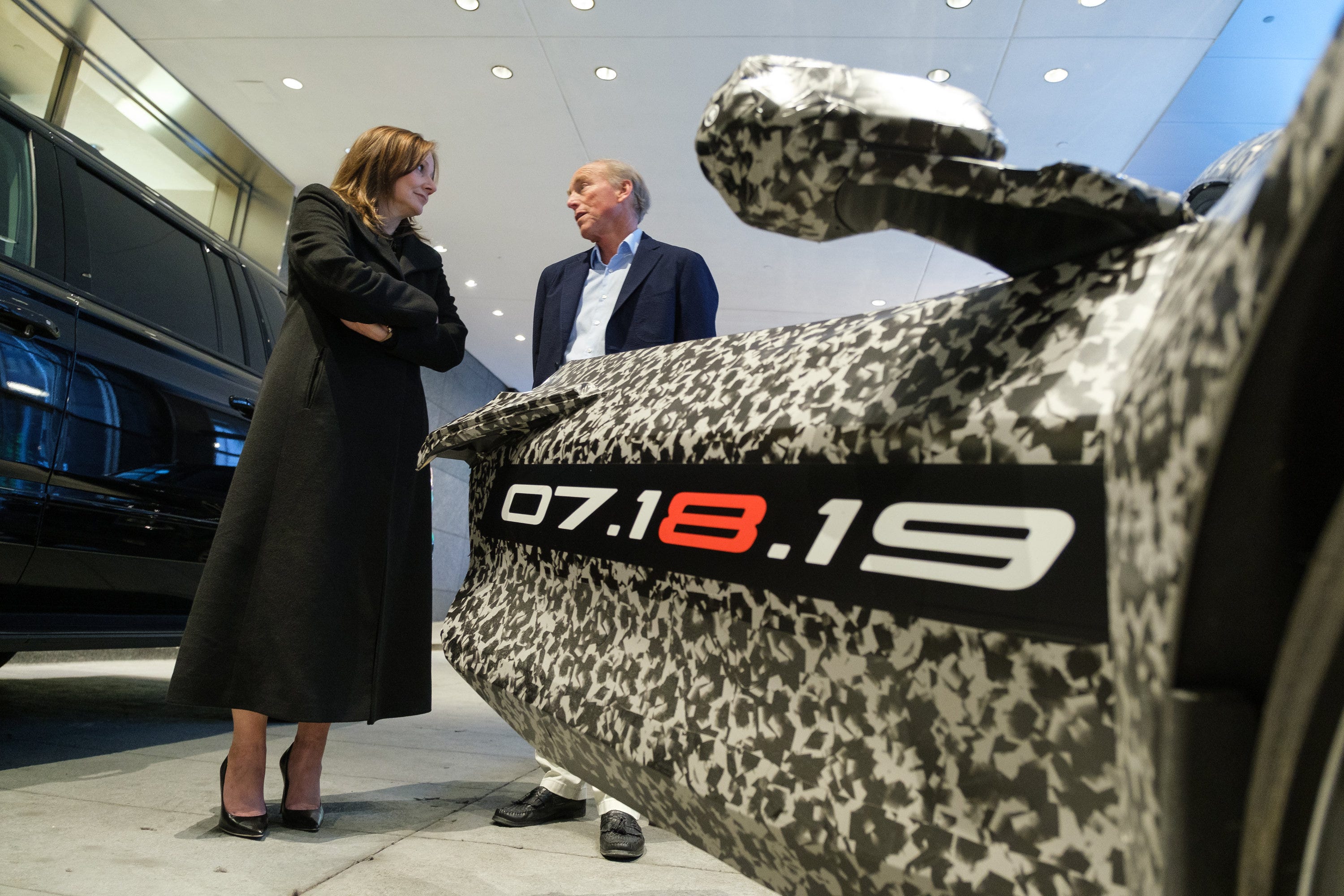 General Motors Chairman and CEO Mary Barra and Chevrolet Corvette Chief Engineer Tadge Juechter Thursday, April 11, 2019 with a camouflaged next generation Chevrolet Corvette in New York City.