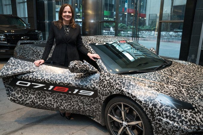 General Motors Chairman and CEO Mary Barra and a camouflaged next generation Chevrolet Corvette Thursday, April 11, 2019 in New York, New York. The next generation Corvette will be unveiled on July 18.
