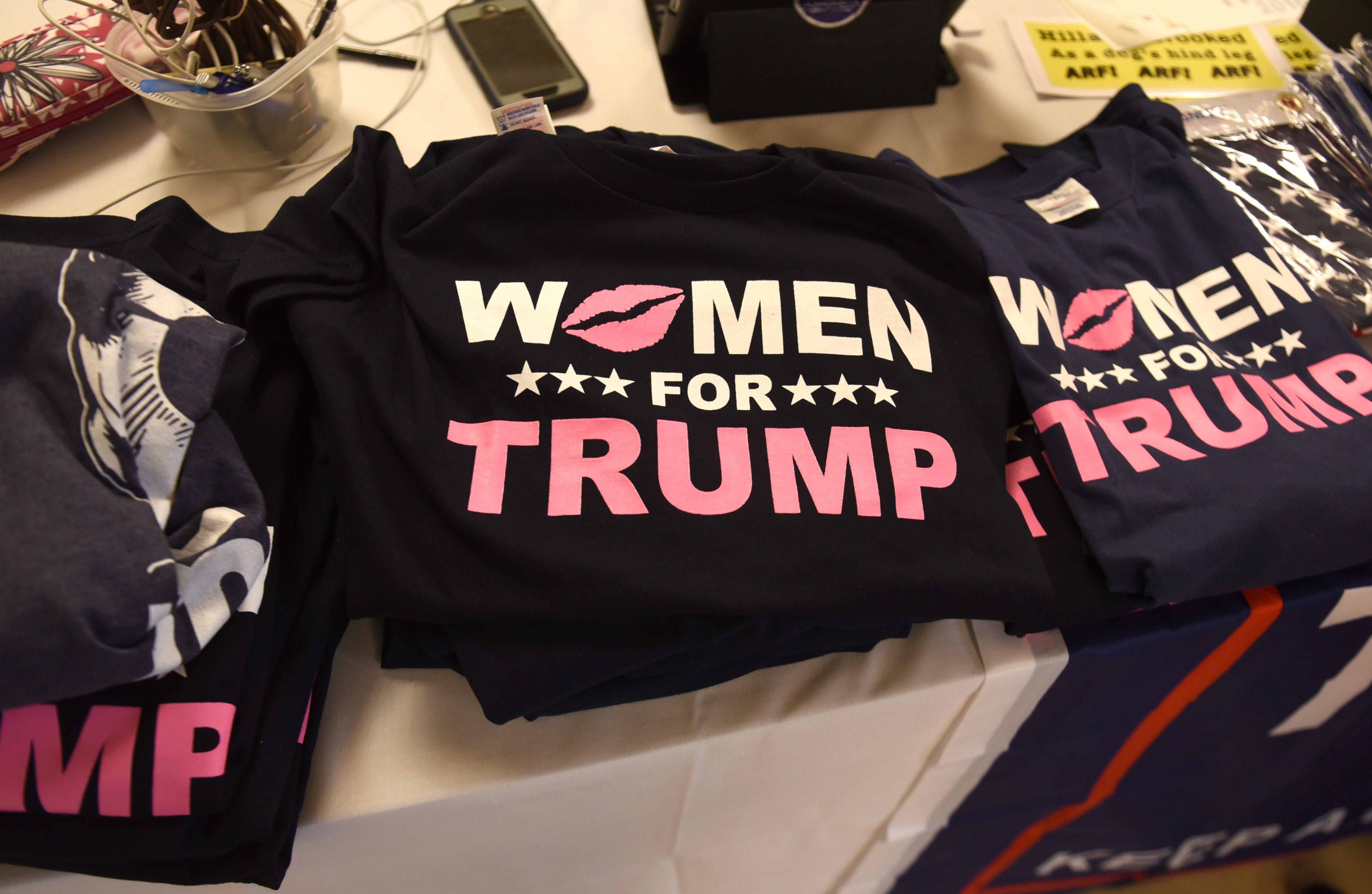Women for Trump T-shirts are among the merchandise for sale at the Trumperware luncheon.