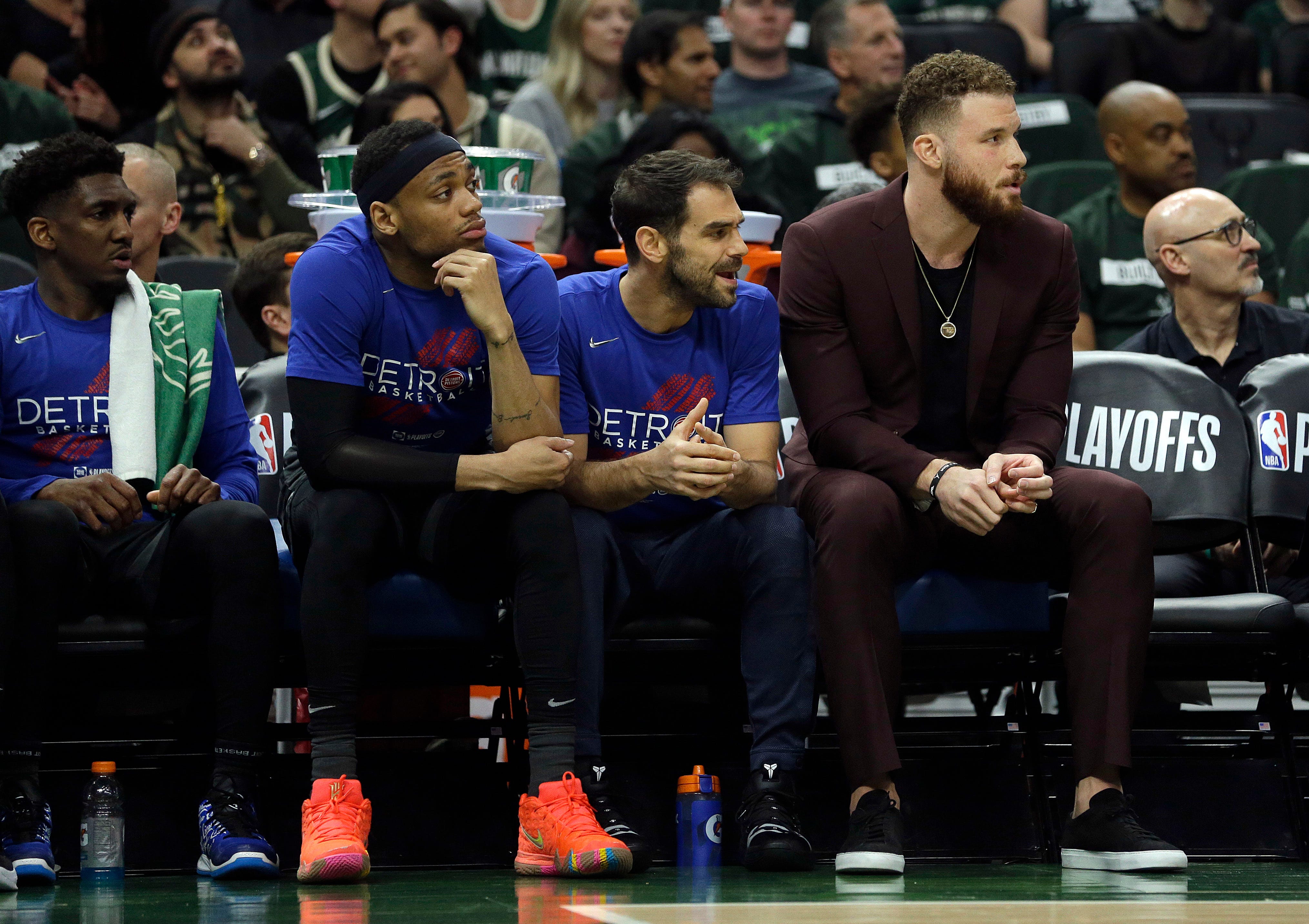 Pistons' Blake Griffin, right, watches from the bench during the first half of Game 1 on Sunday.