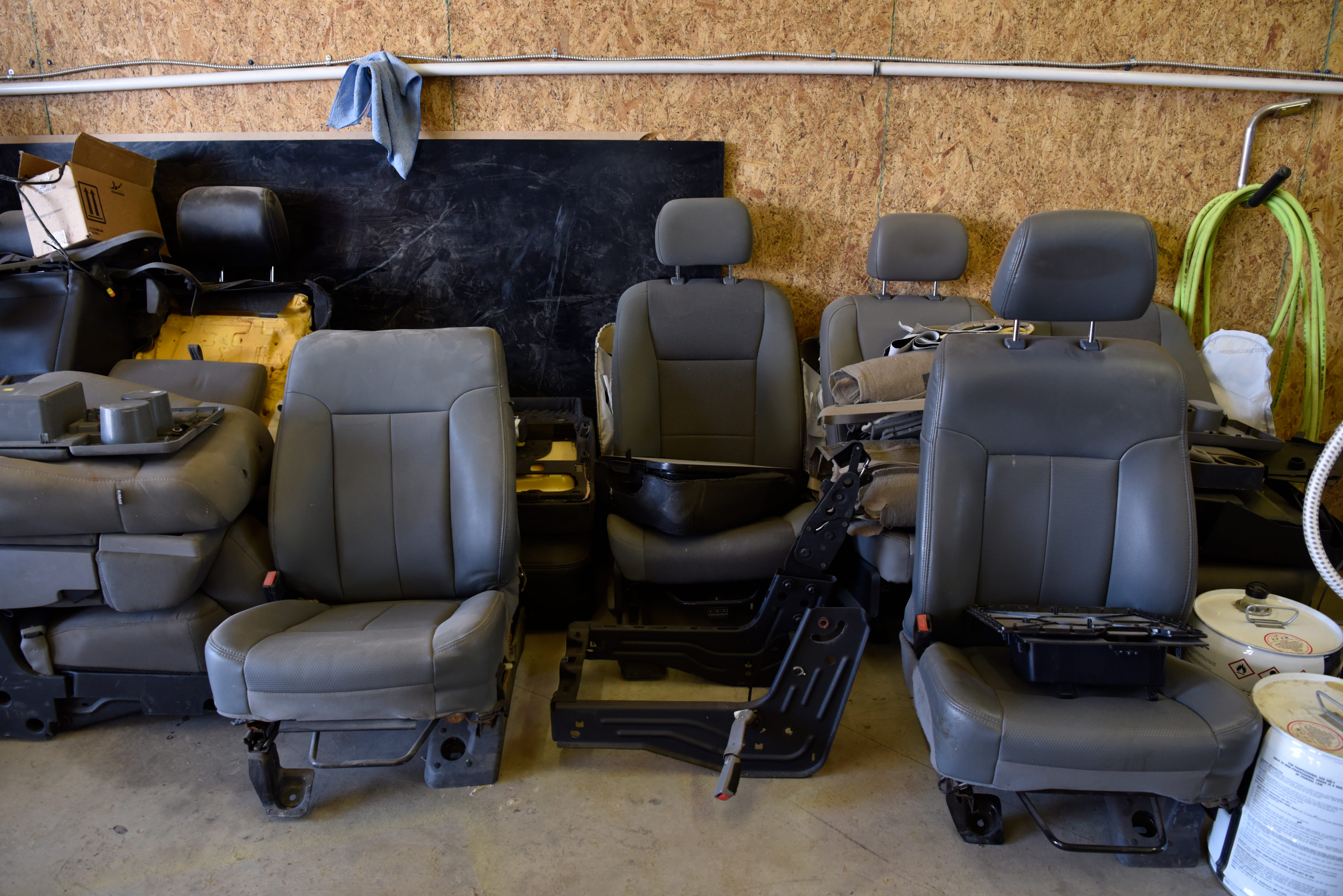 Used Ford Excursion seats wait for new upholstery at  Custom Autos By Tim in Guthrie, Oklahoma
