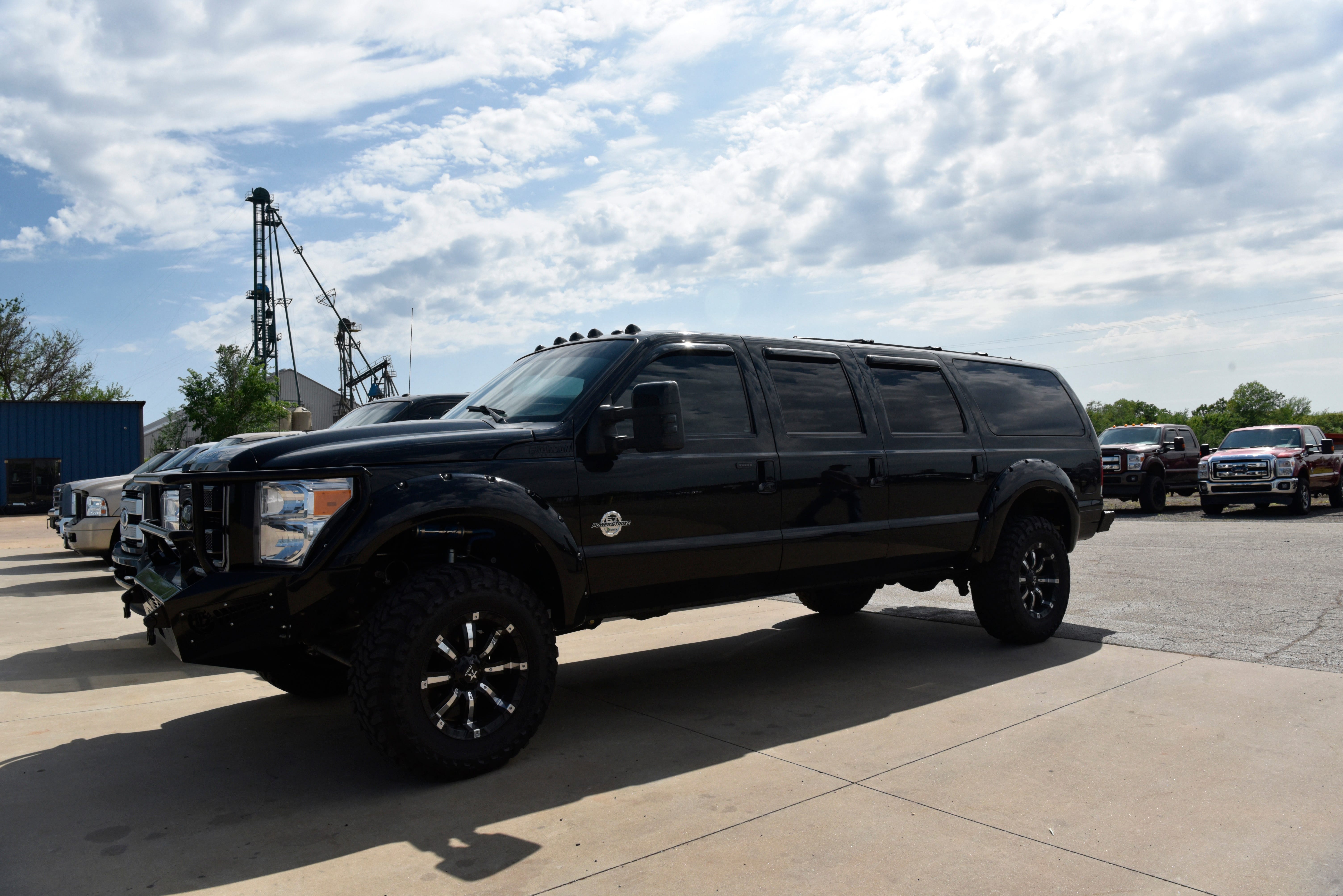 A custom built six-door Ford Excursion sits in the lot at Custom Autos By Tim in Guthrie, Oklahoma on April 26, 2019.