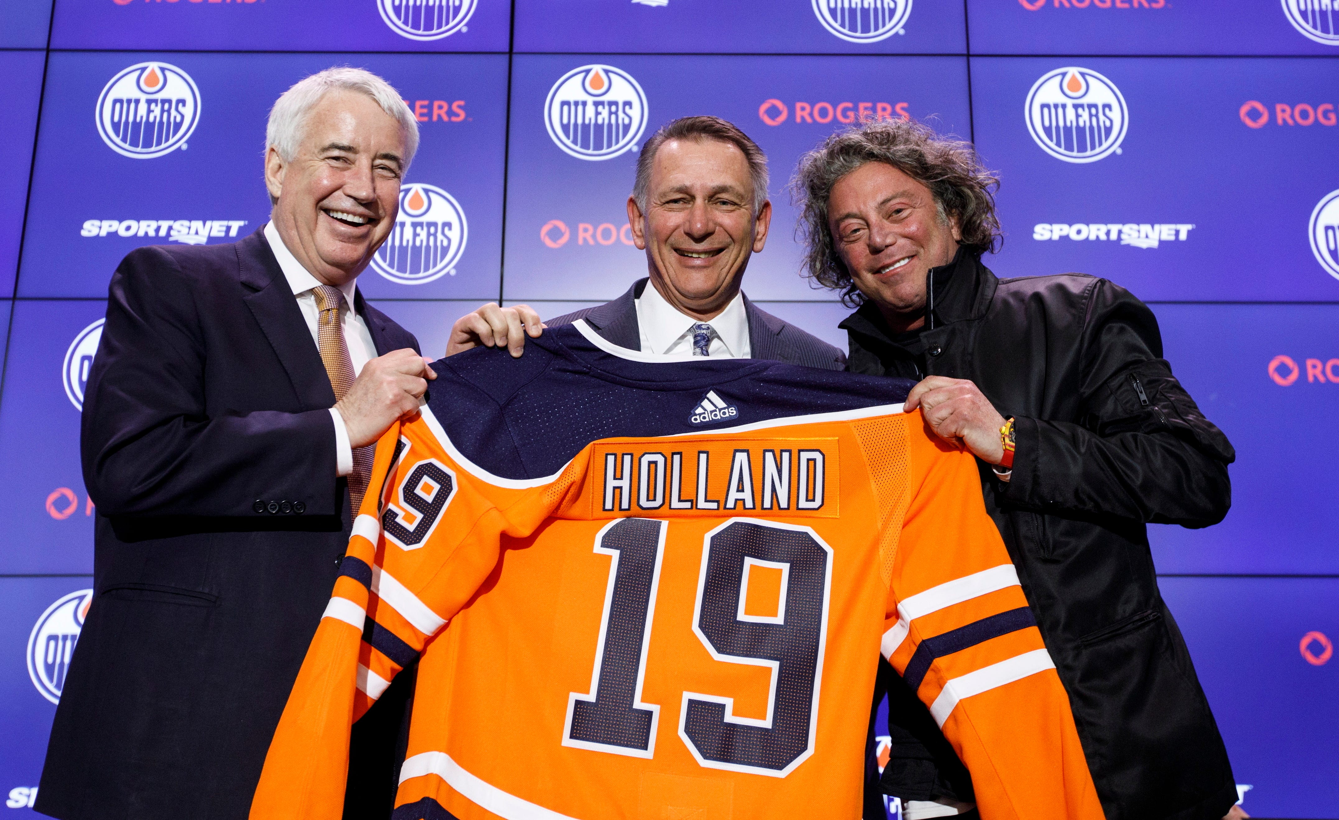 Ken Holland, center, is introduced as new Oilers GM by vice-chair Bob Nicholson, left, and owner Daryl Katz.