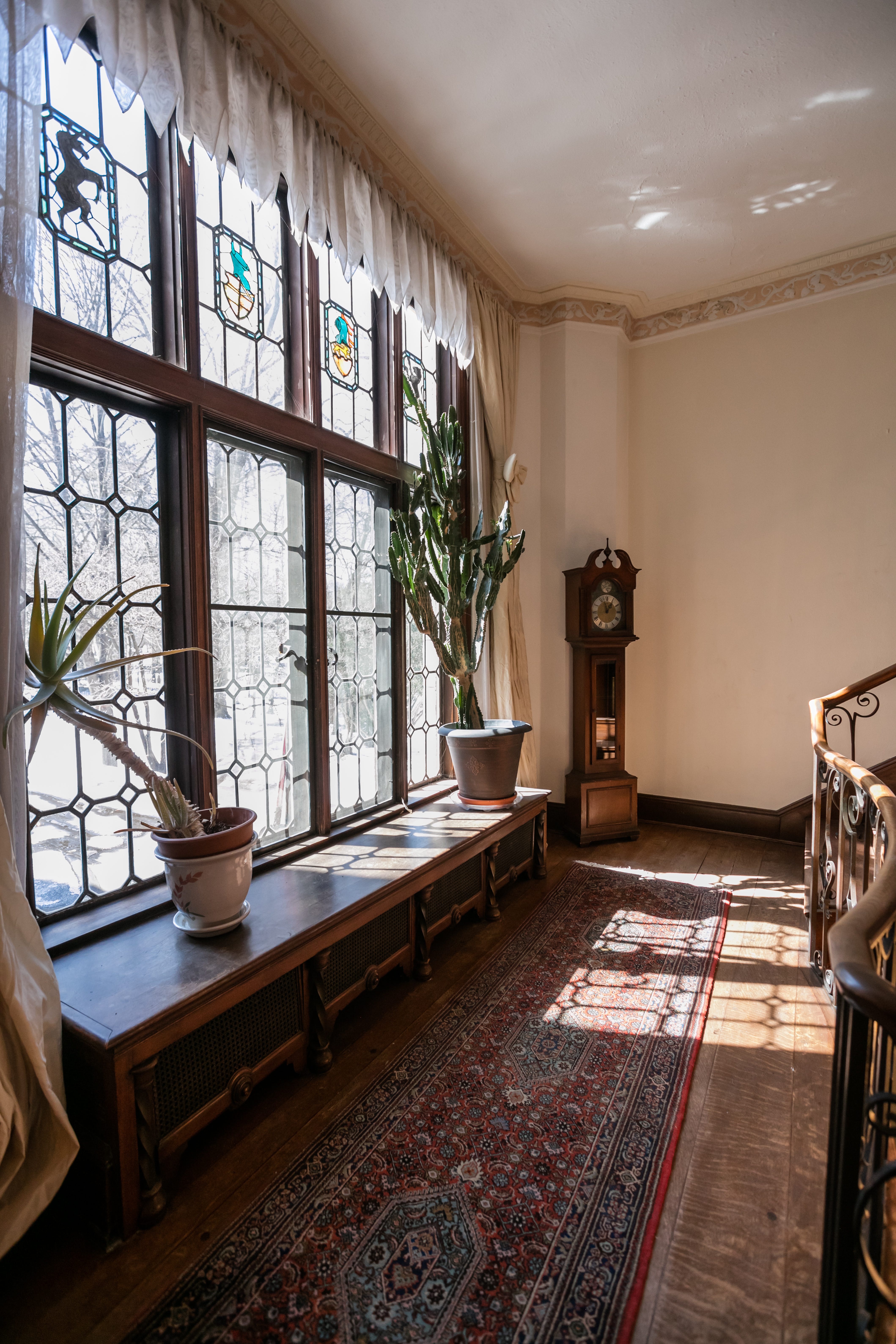 The three-story Tudor-style house, with an asking price of just under a million dollars, includes fine American custom limestone, plaster ceilings throughout, stained glass windows, brick, woodworking and slate.