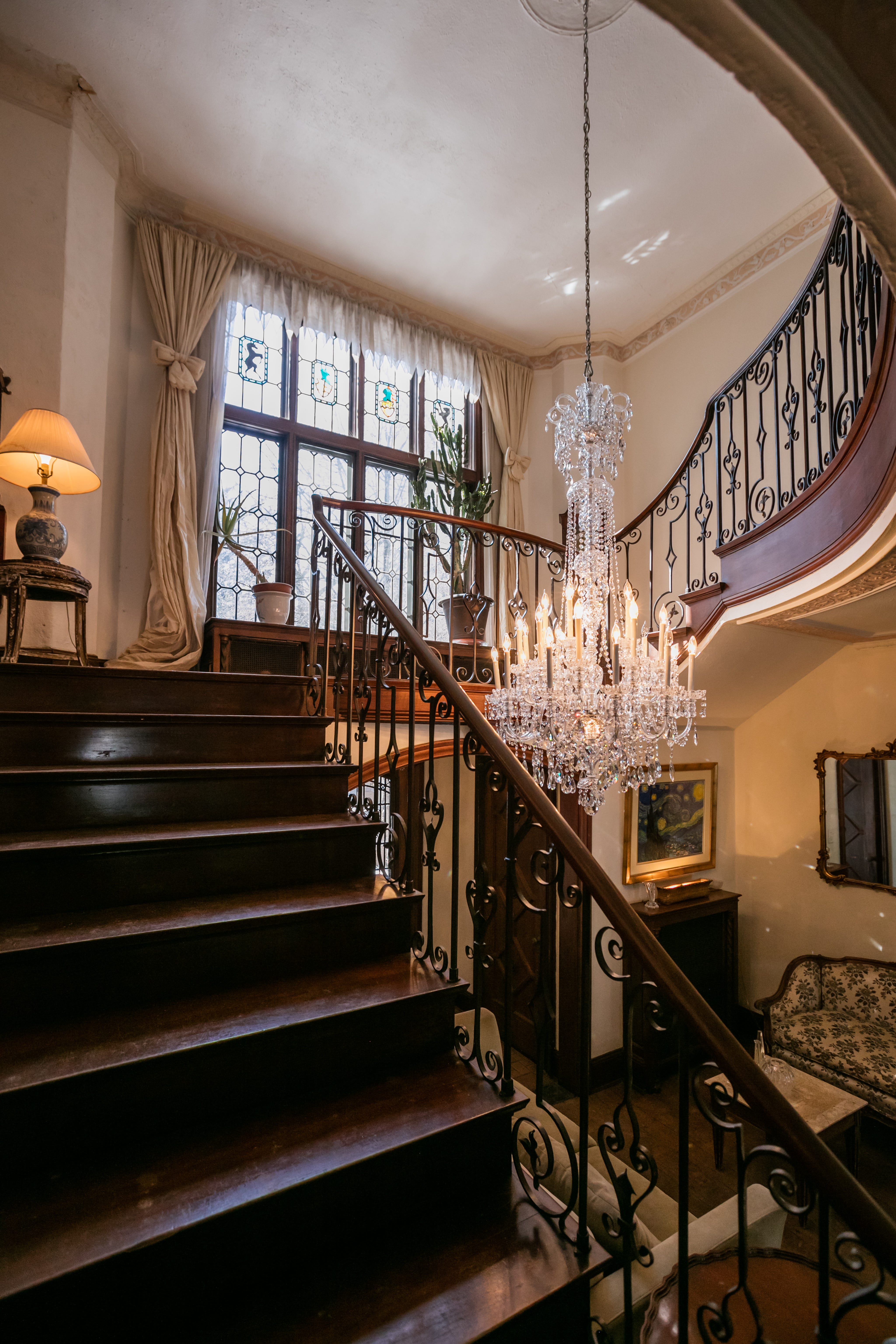 The three-story Tudor-style house, with an asking price of just under a million dollars, includes fine American custom limestone, plaster ceilings throughout, stained glass windows, brick, woodworking and slate.