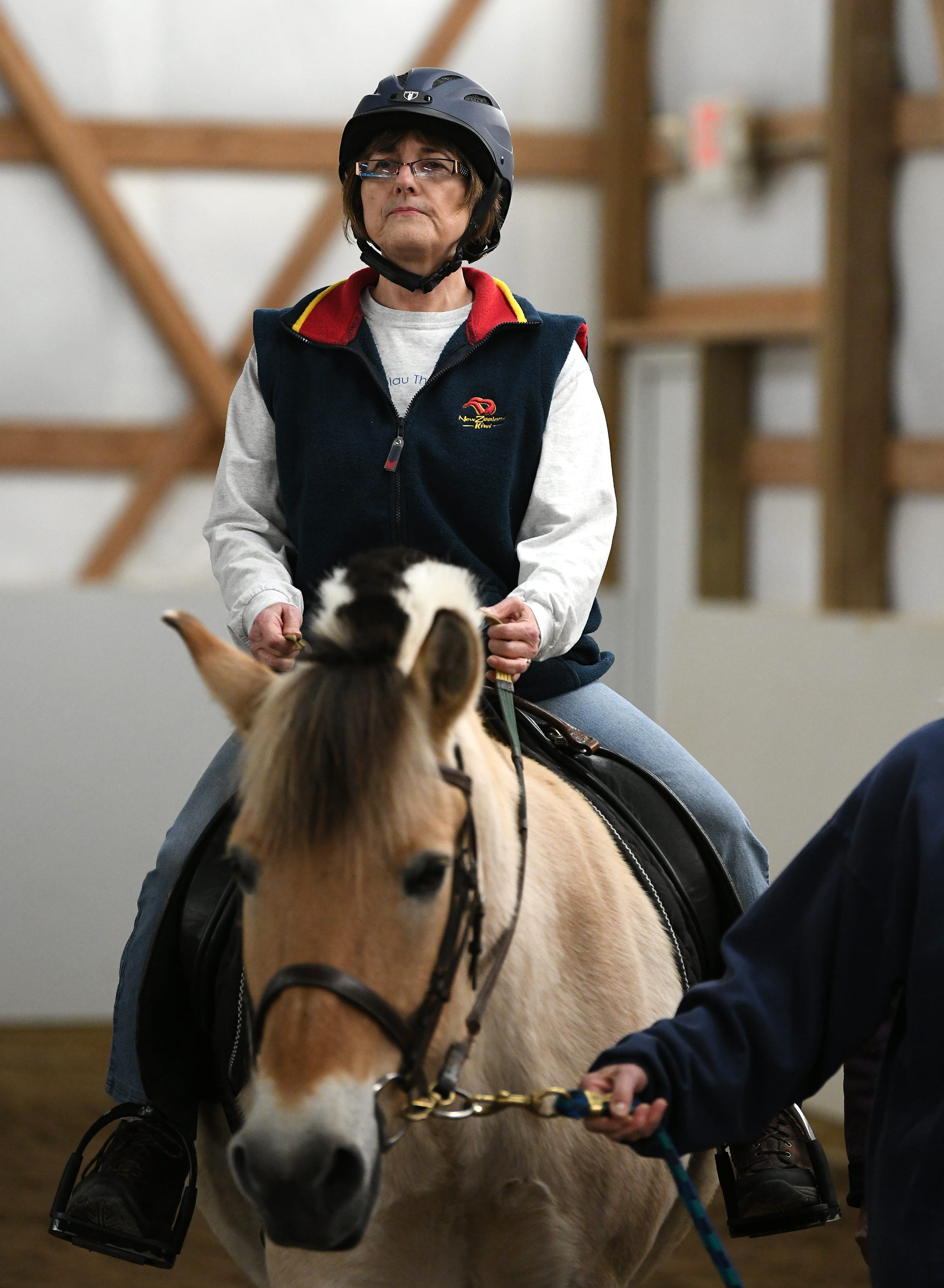 Deb Swartz makes her way around the riding ring on the horse Sigbjorn.