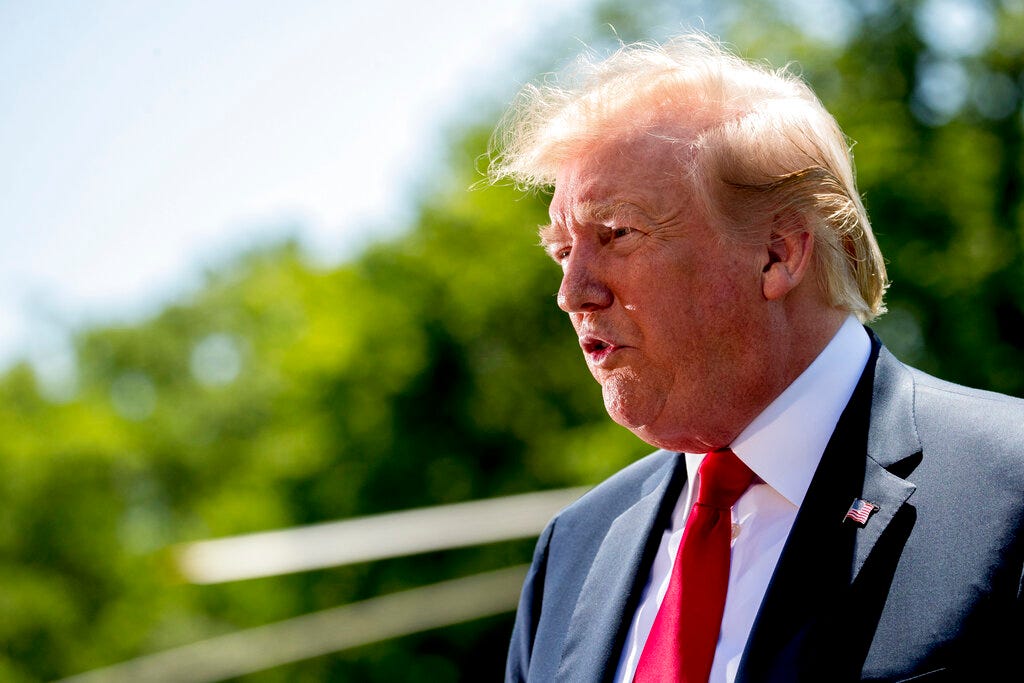 President Donald Trump speaks to the media on the South Lawn of the White House in Washington, Friday, May 24, 2019. Trump is considering pardons for several American military members accused of war crimes.