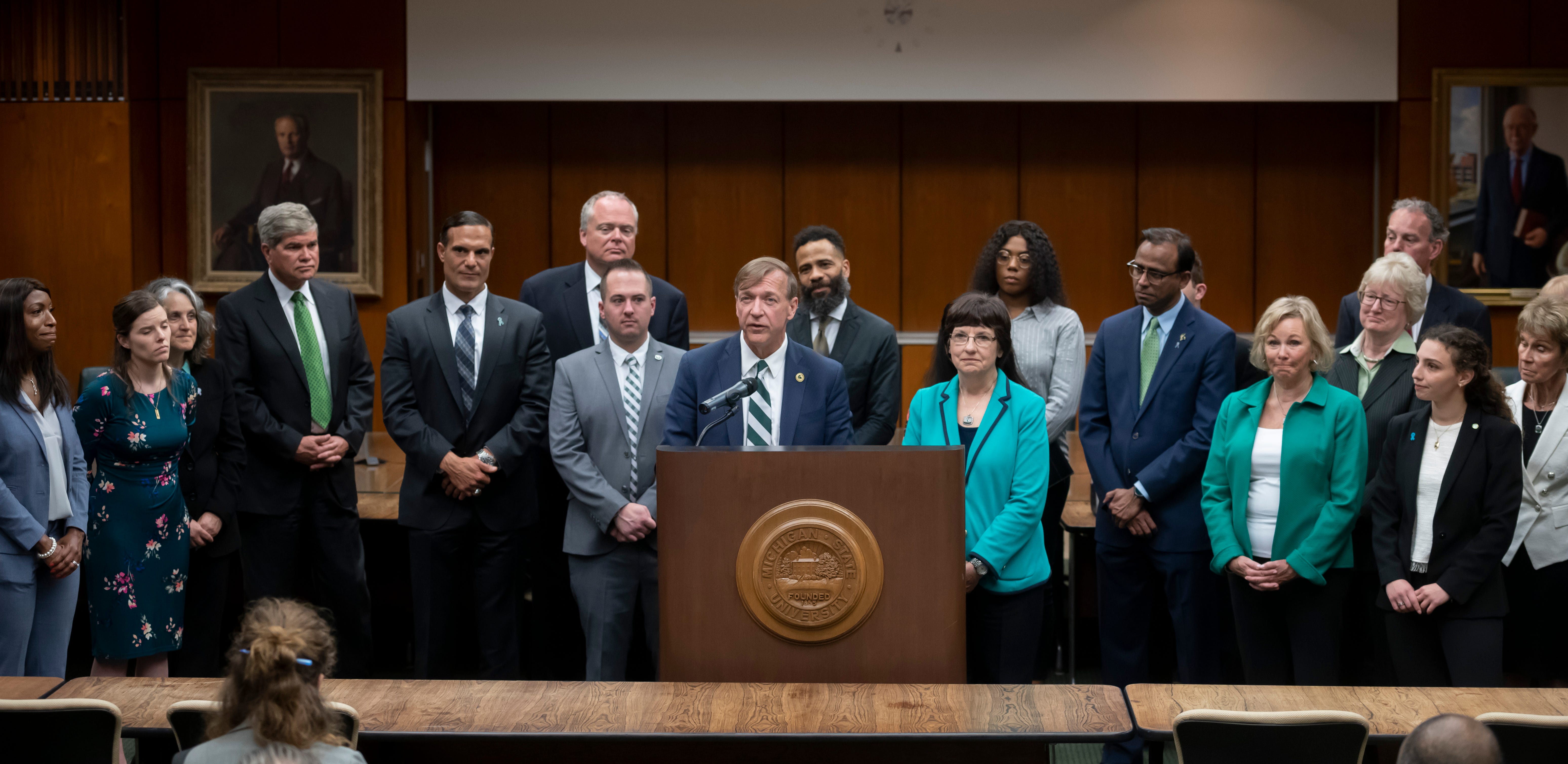Samuel Stanley Jr., center, surrounded by faculty, trustees and search committee members, participates in a question and answer session after the Michigan State University board of trustees voted to elect him the university's 21st president, May 28, 2019.