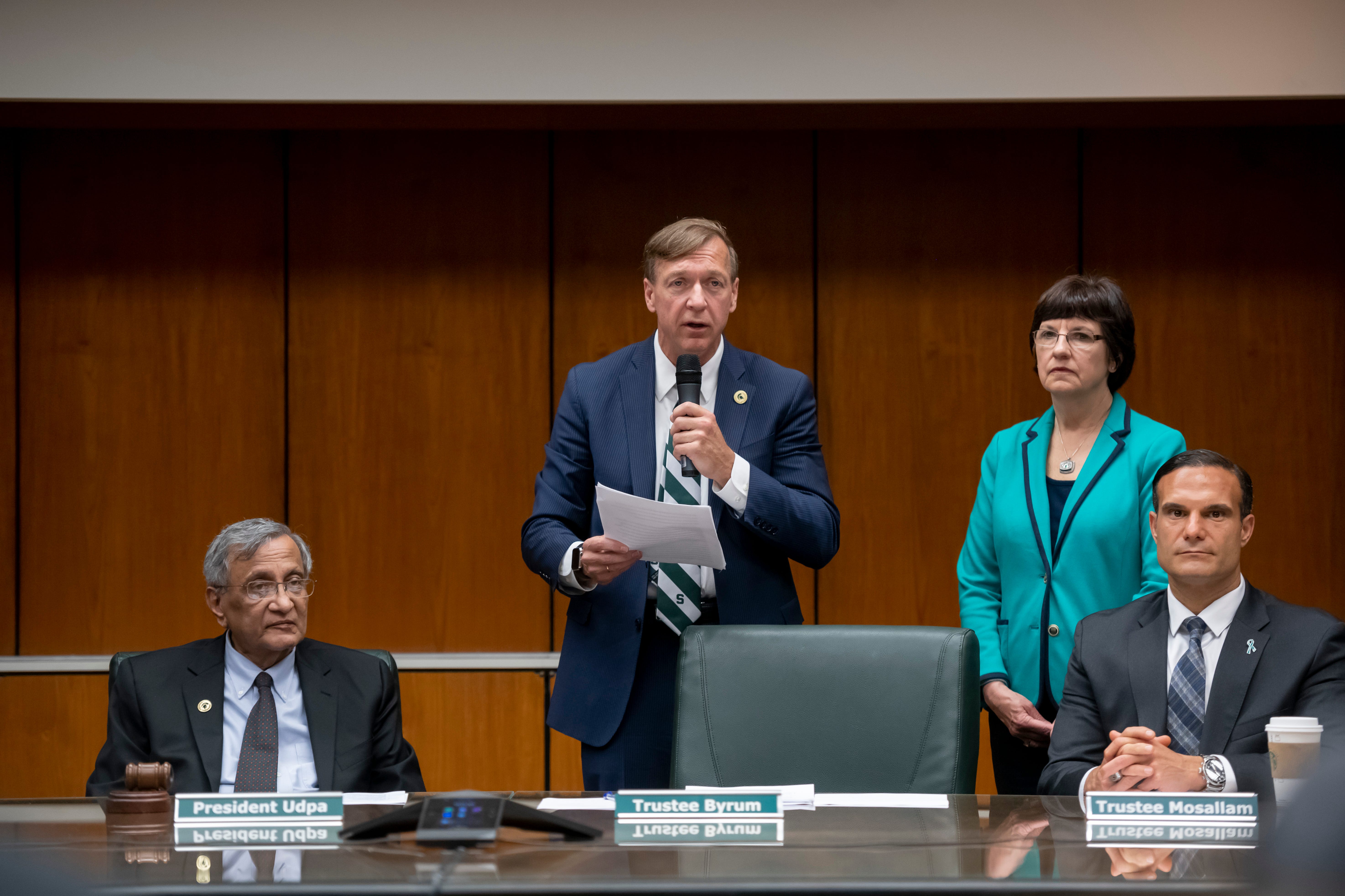 From left, acting president Satish Udpa, incoming president Samuel Stanley Jr., trustee chair Dianne Byrum, and trustee Brian Mosallam listen to Stanley address a special session of the Michigan State University board of trustees that voted to elect him the 21st president of the university, May 28, 2019.