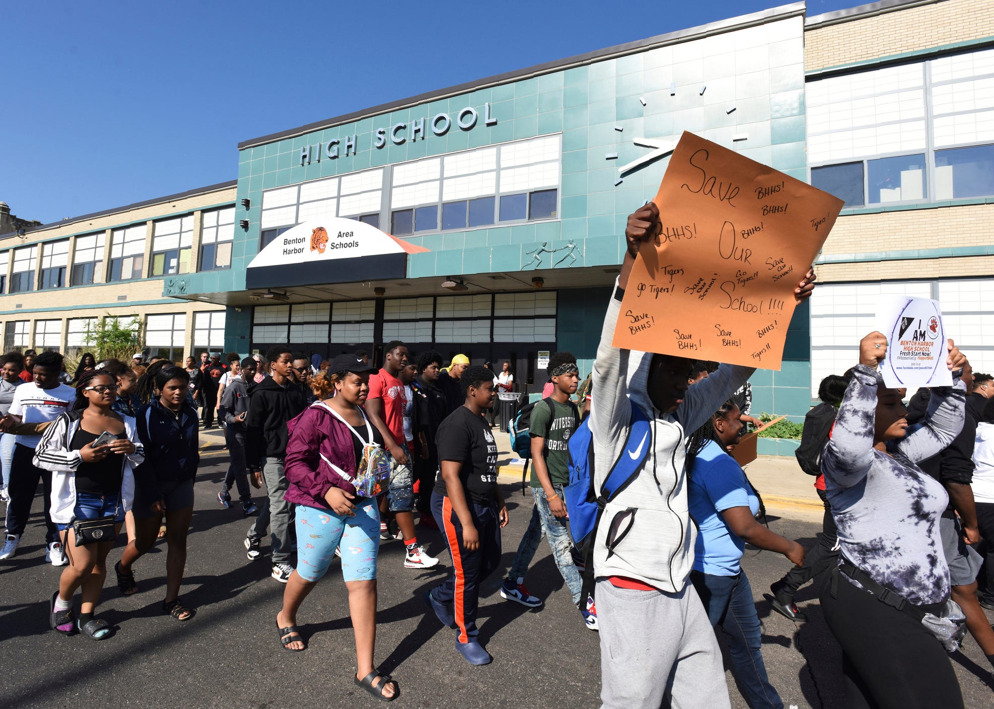 Students walk past the front of the high school in Benton Harbor earlier this month in preparation of an annual Peace Walk held at the end of the school year.