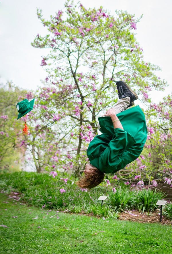 People and Places People ' s Choice Award: " Graduate in Full Bloom, " by Camille Biggs of East Lansing. Michigan State computer engineering graduate Frankie Riviera does a celebratory backflip outside of the library on campus. " The photo really depicts the excitement and fervor of the graduation season, " she said, " and captures the personality of the graduate.