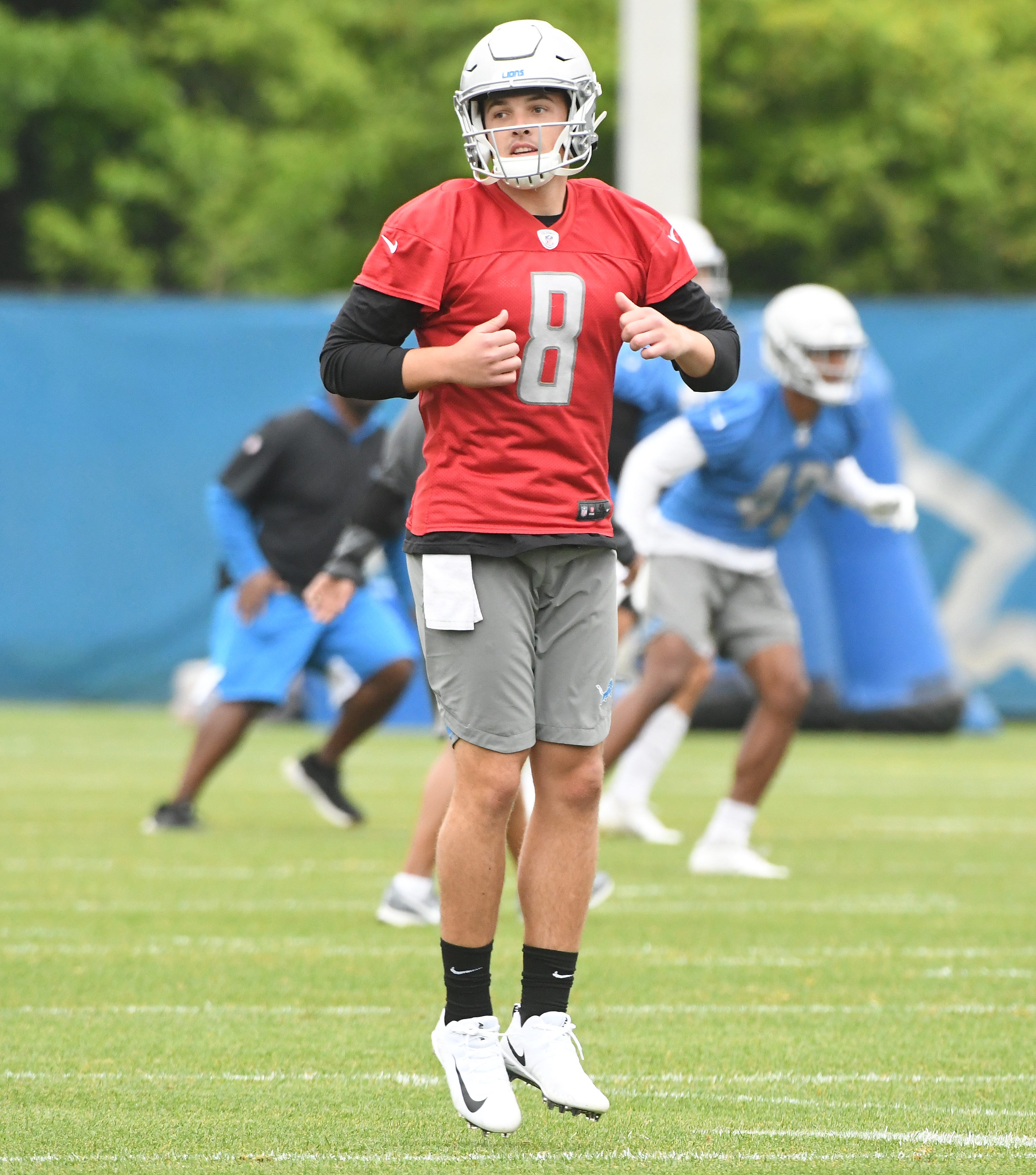 Newly acquired quarterback David Fales stretches out a the start of practice.