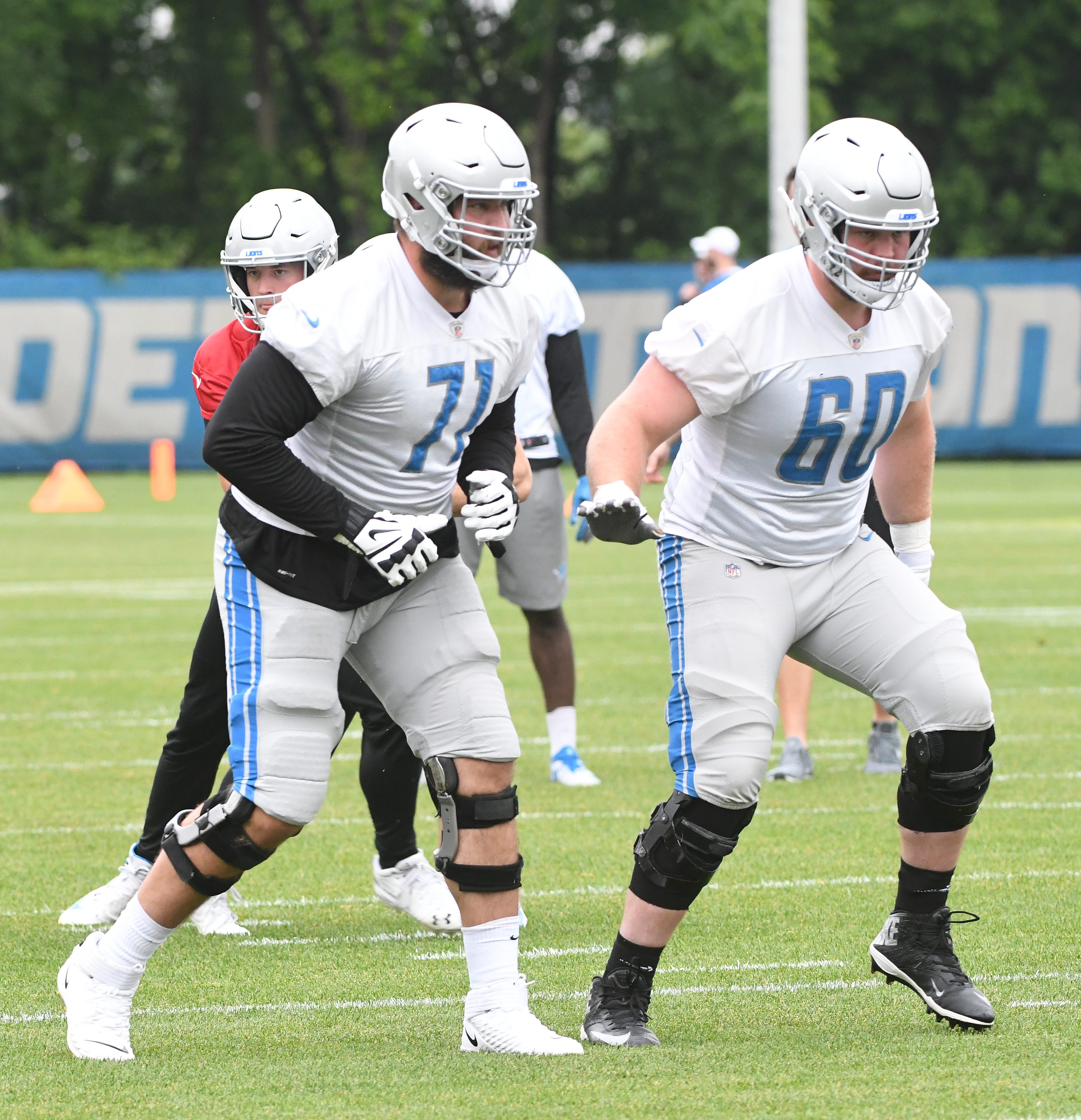 Lions quarterback Matthew Stafford in the pocket behind linemen Rick Wagner and Graham Glasgow during drills.