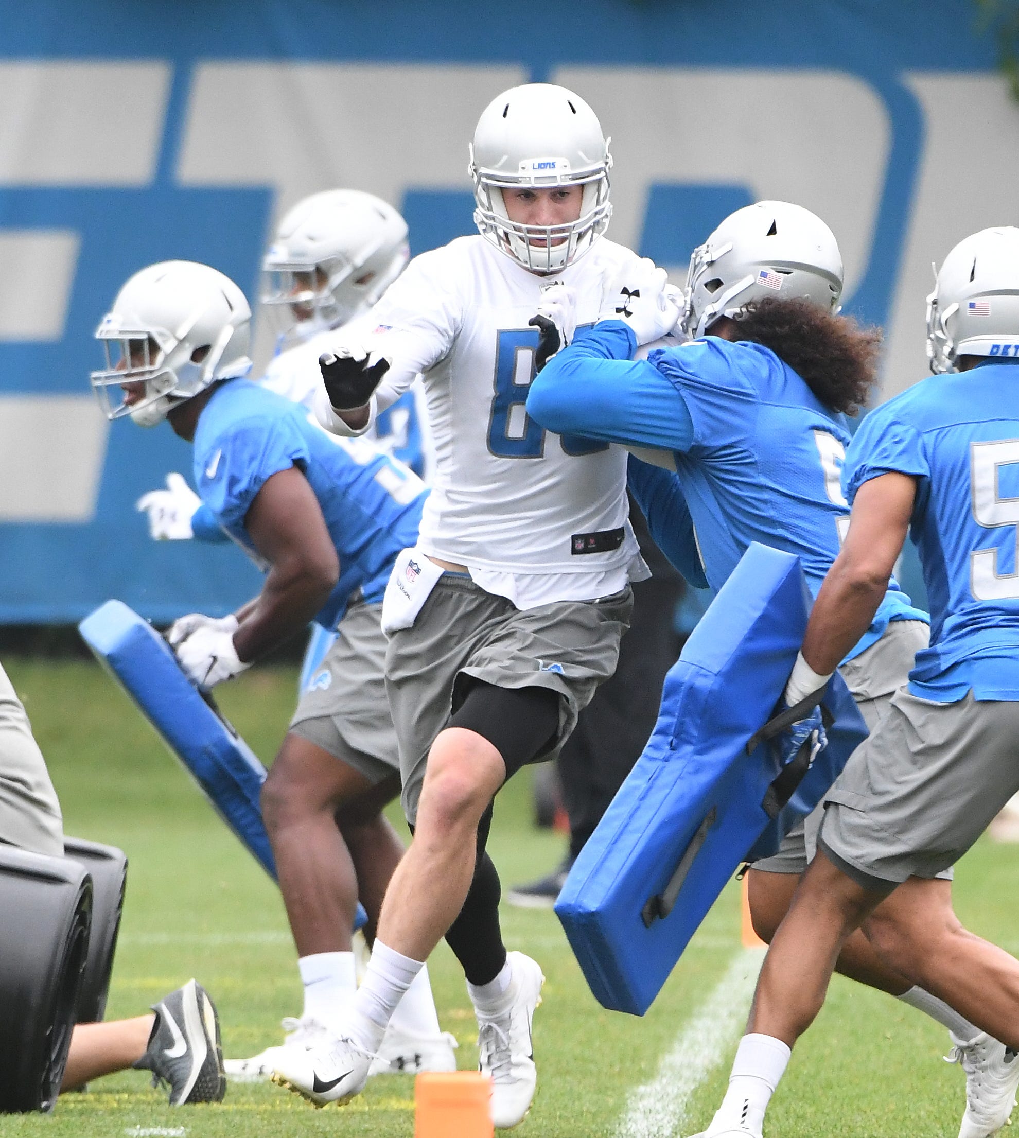 Lions tight end Jesse James works against the defense during drills.